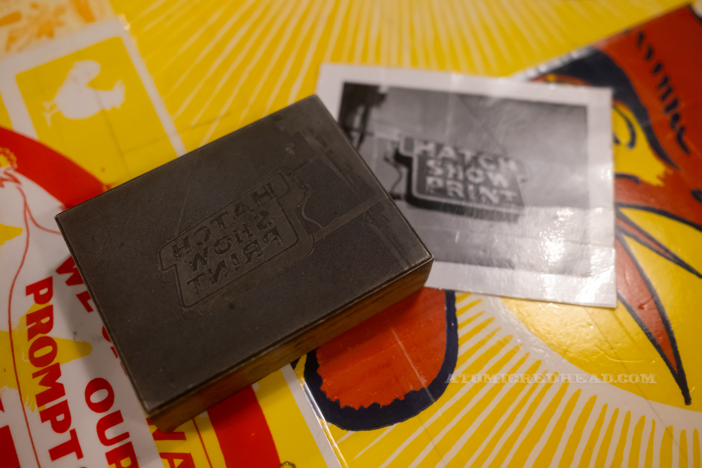 Close-up of a photo plate, an etching from a photograph, making for easy image print blocks. This one is over the Hatch neon sign.