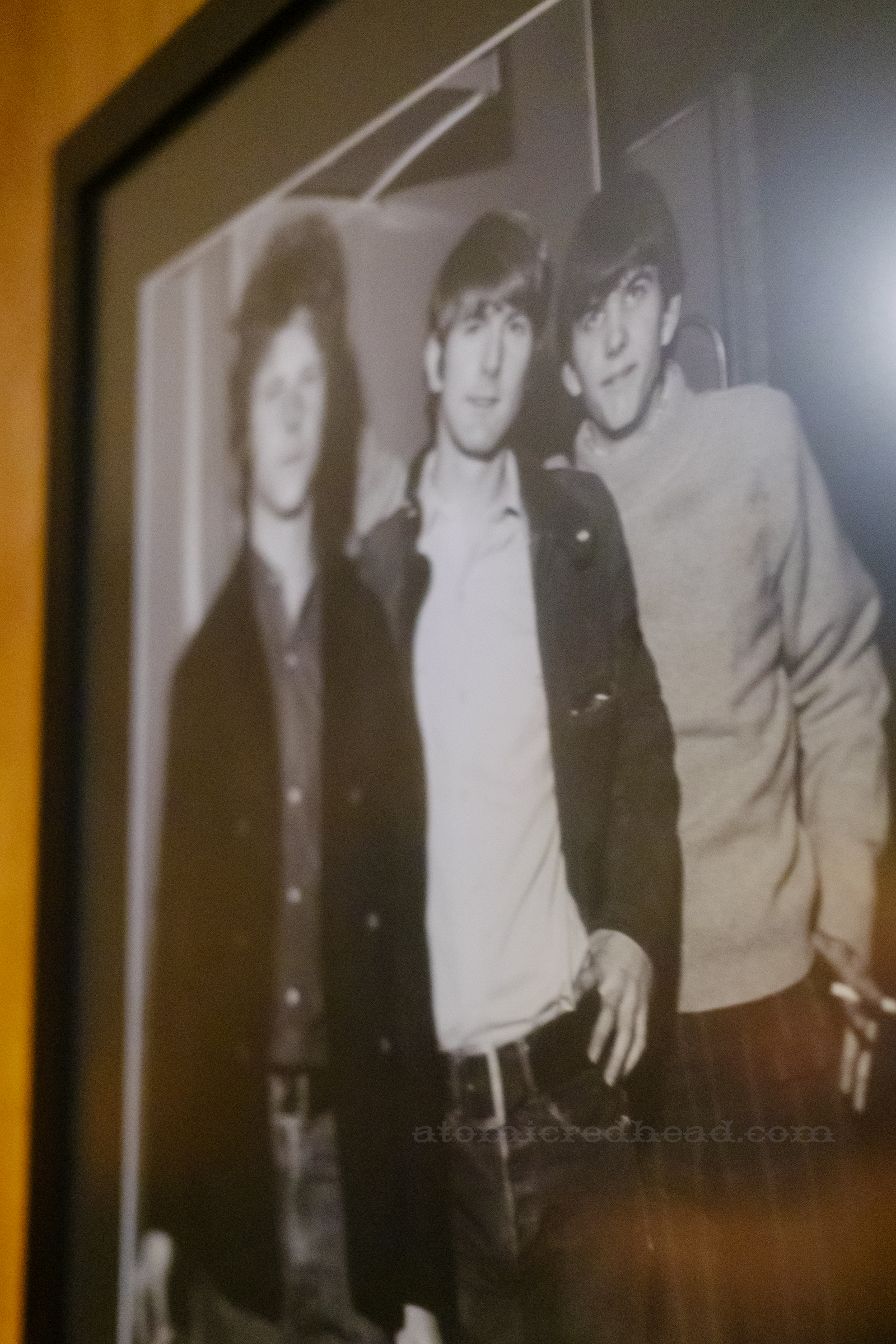 A framed black and white photo of The Byrds from their performance at the Ryman.
