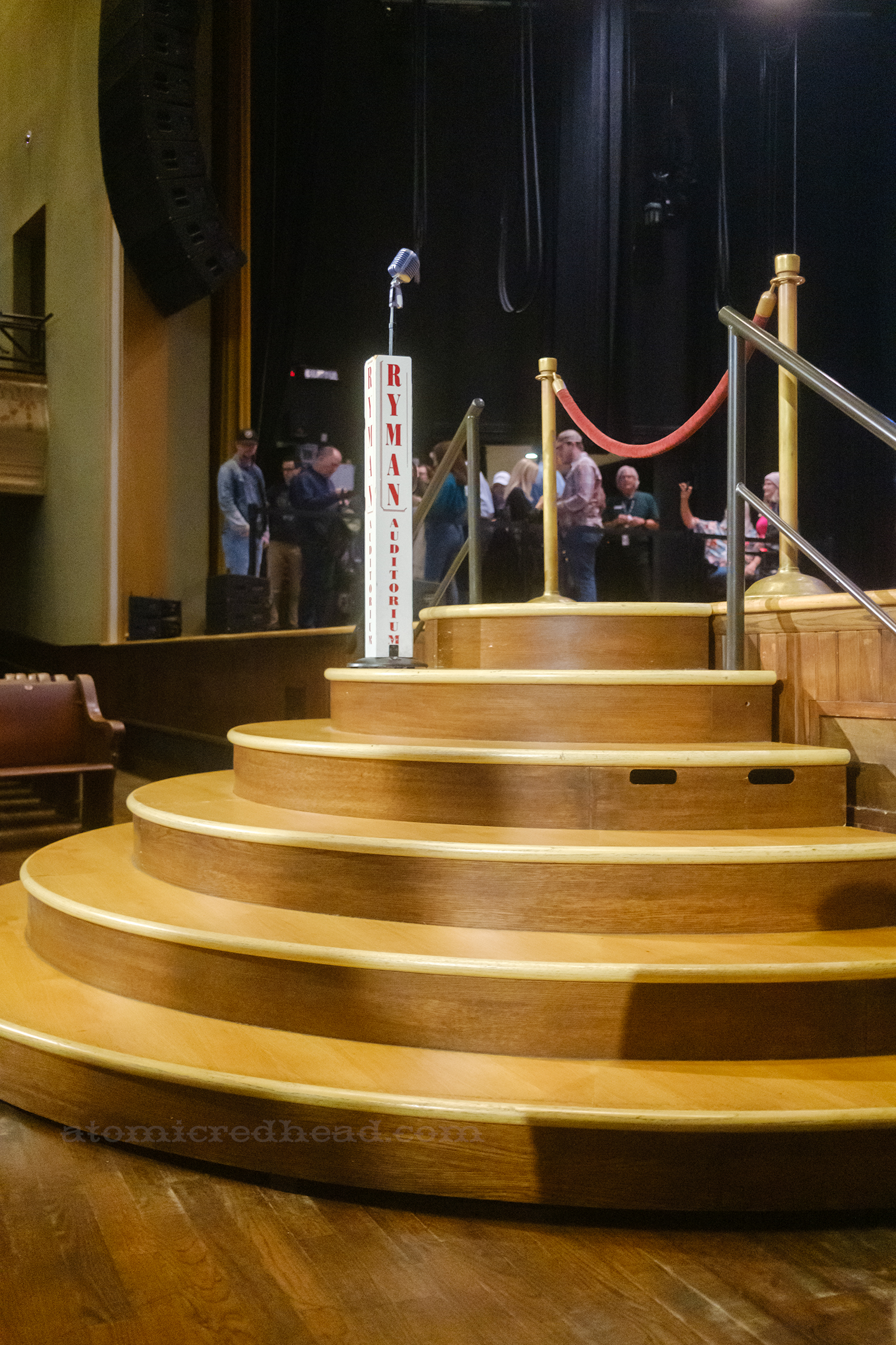 View of the curved steps leading up to the mic at the front of the stage.