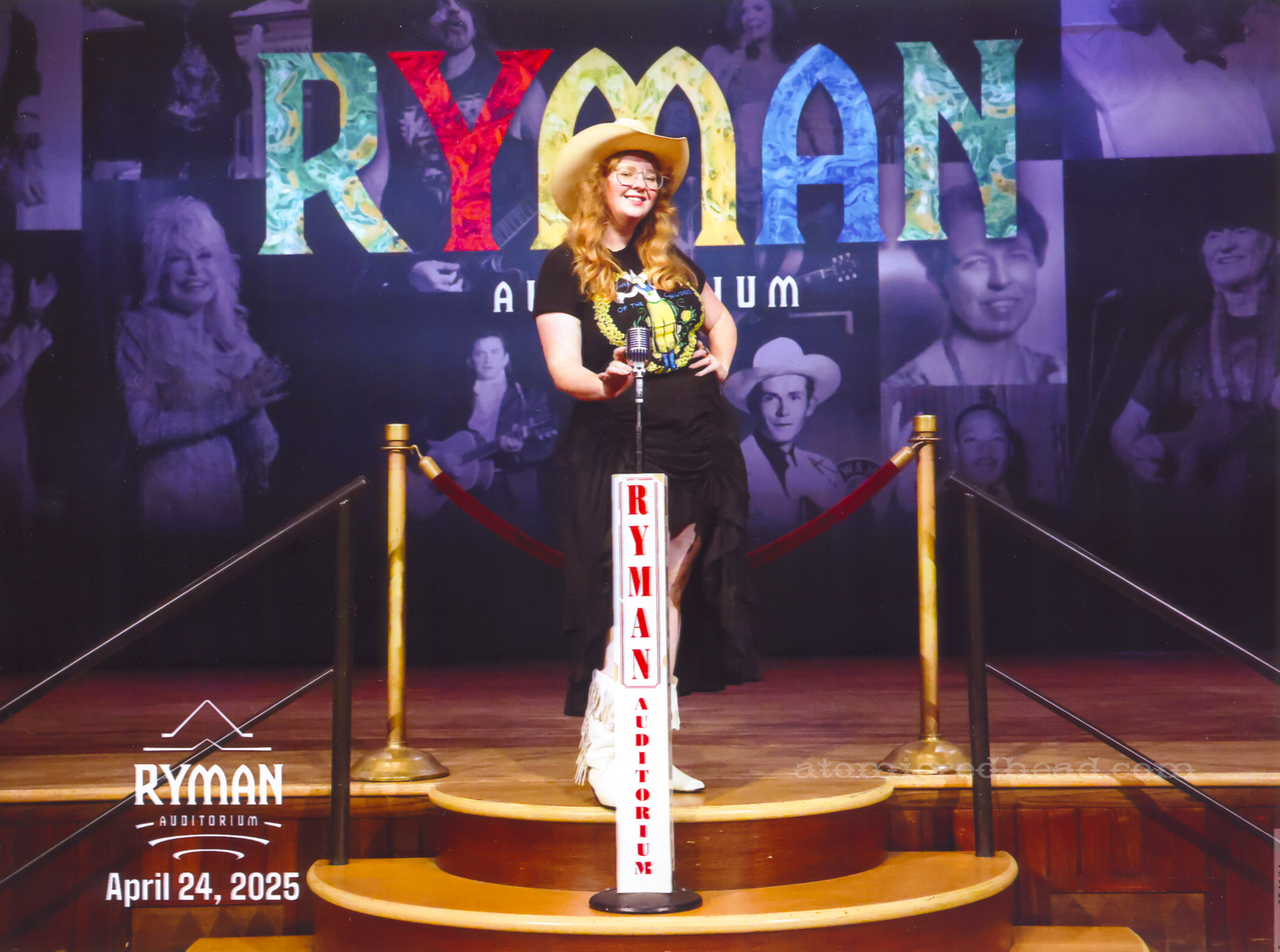 Myself standing at the Ryman microphone on the stage.