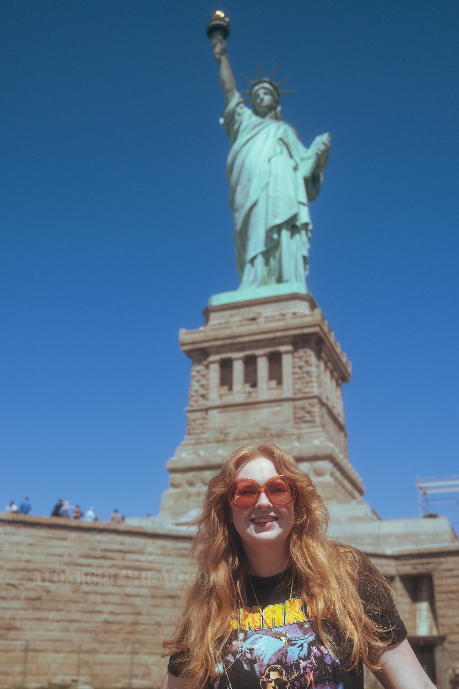 Myself standing in front of the Statue of Liberty.