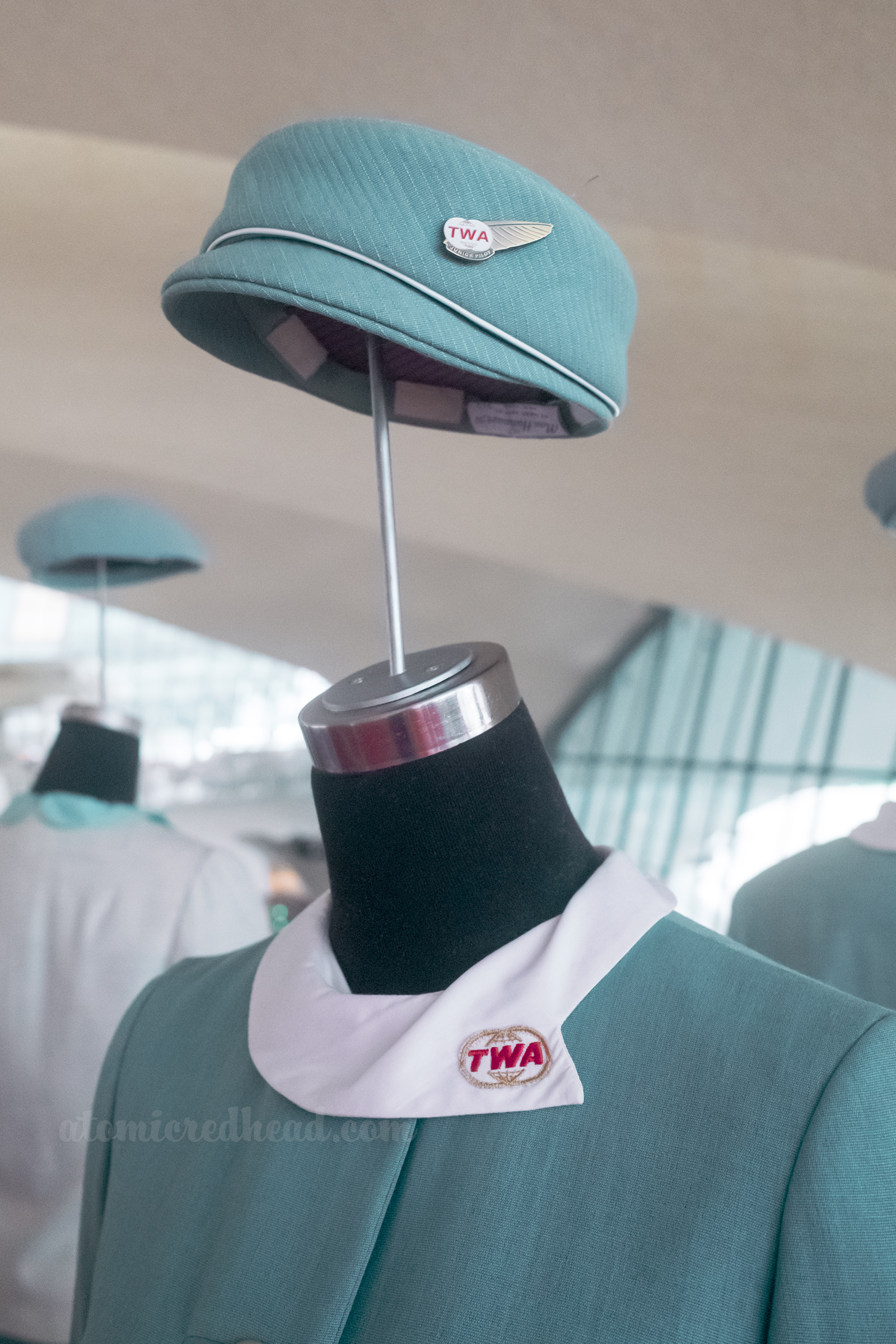 Close-up of a blue 1960s TWA stewardess uniform.