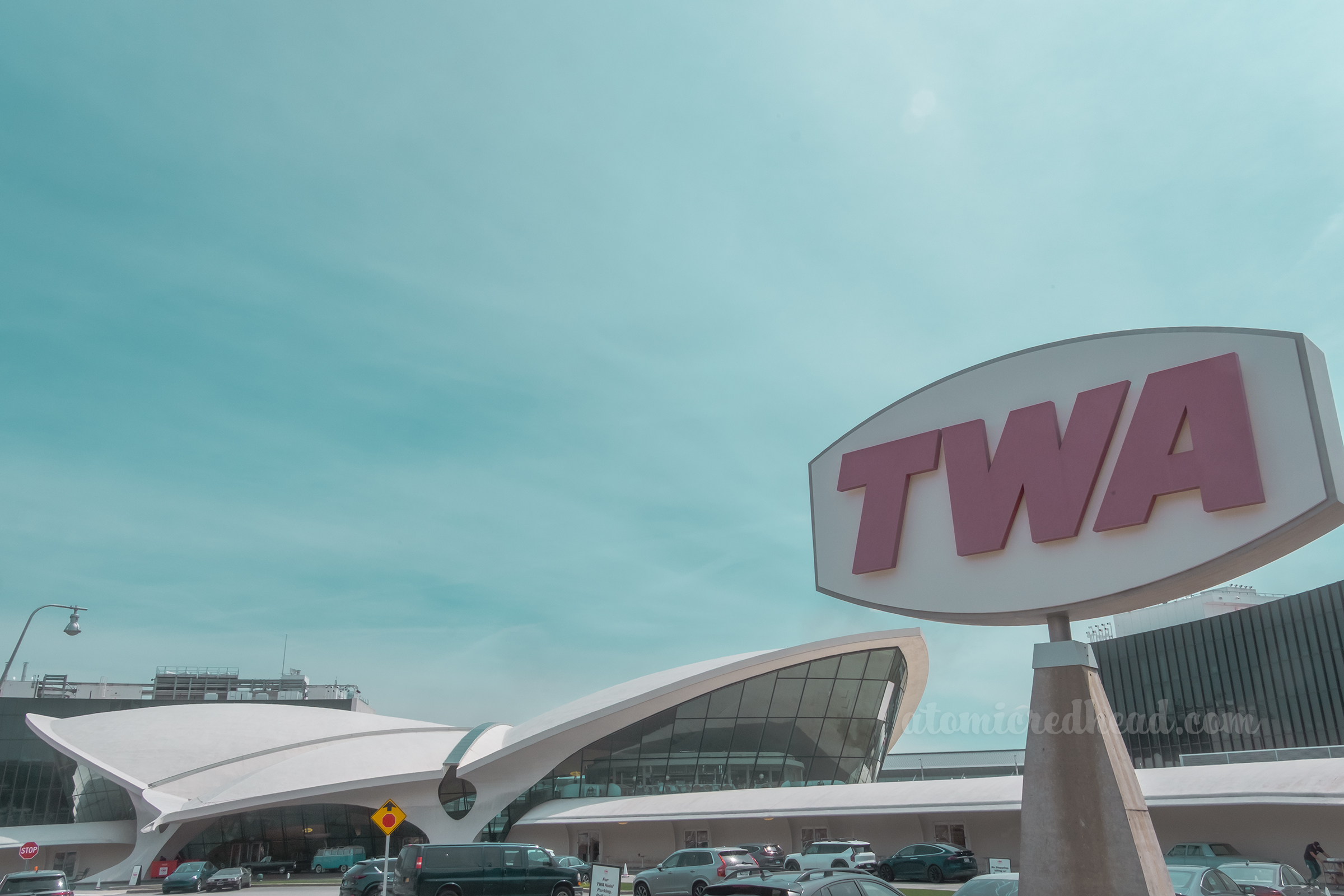 A large TWA sign off to the right, the building off to the left.