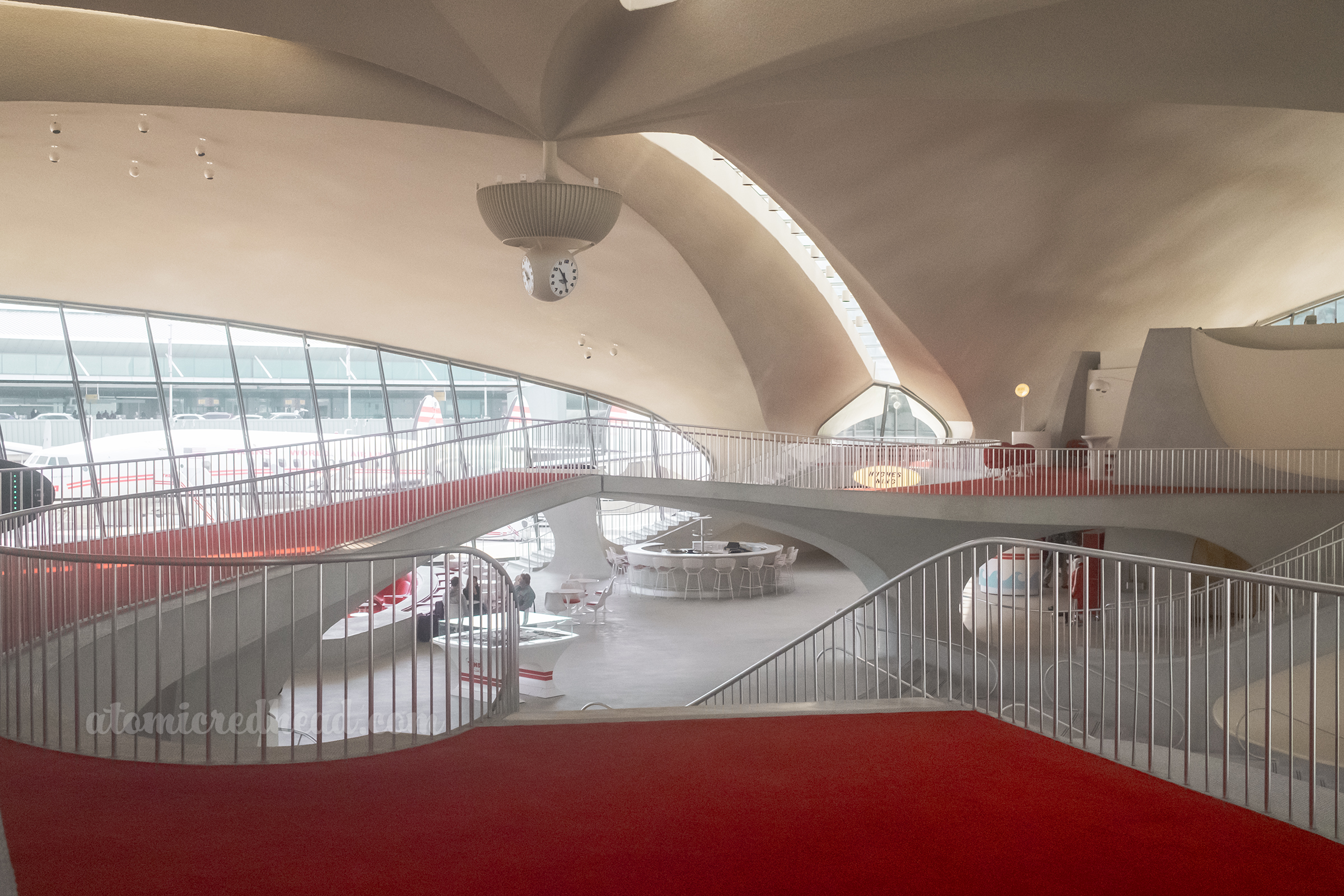 A bridge spans the lobby connecting the upper floors.
