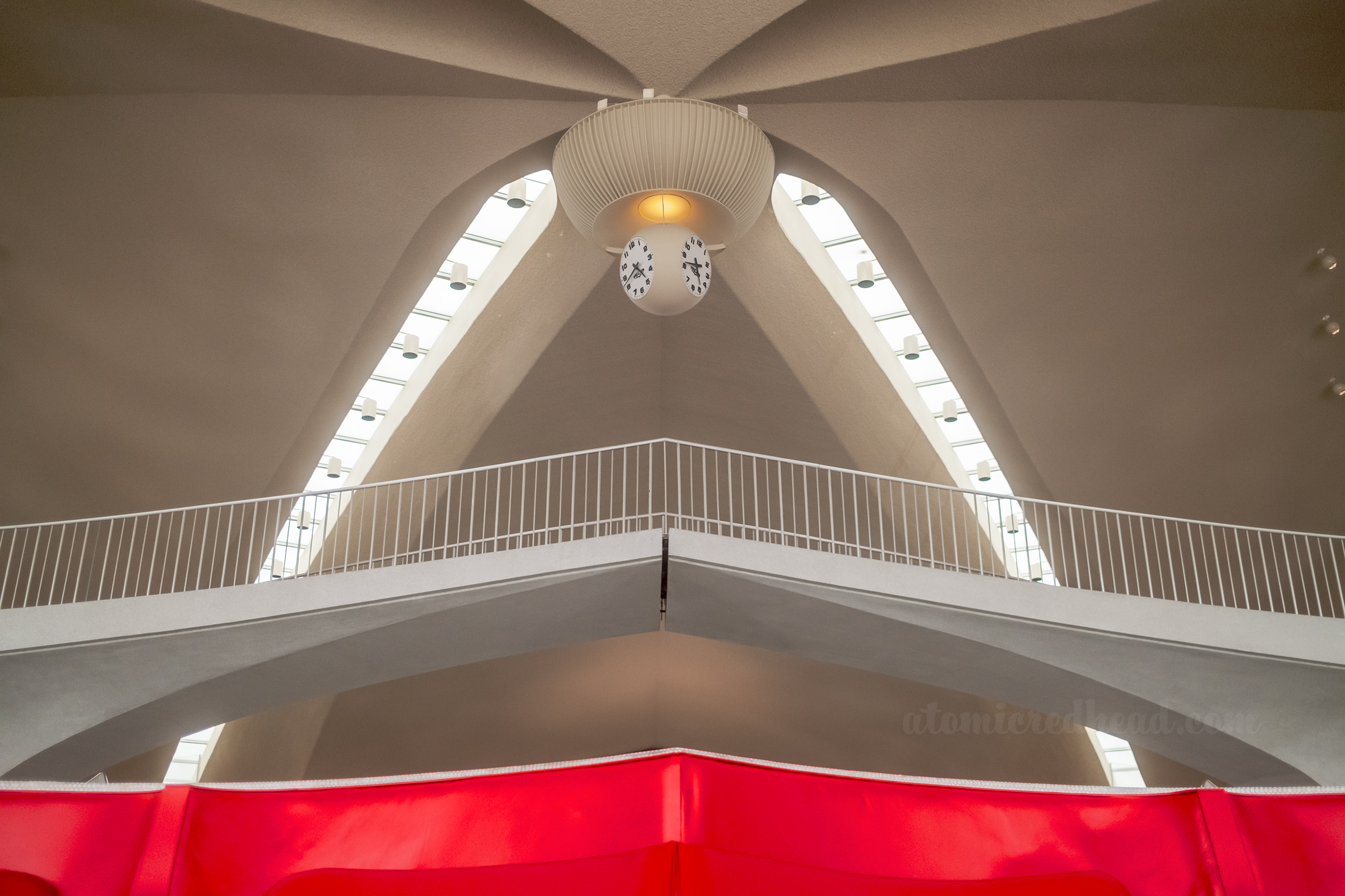 View of the clock that hangs in the center of the lobby.