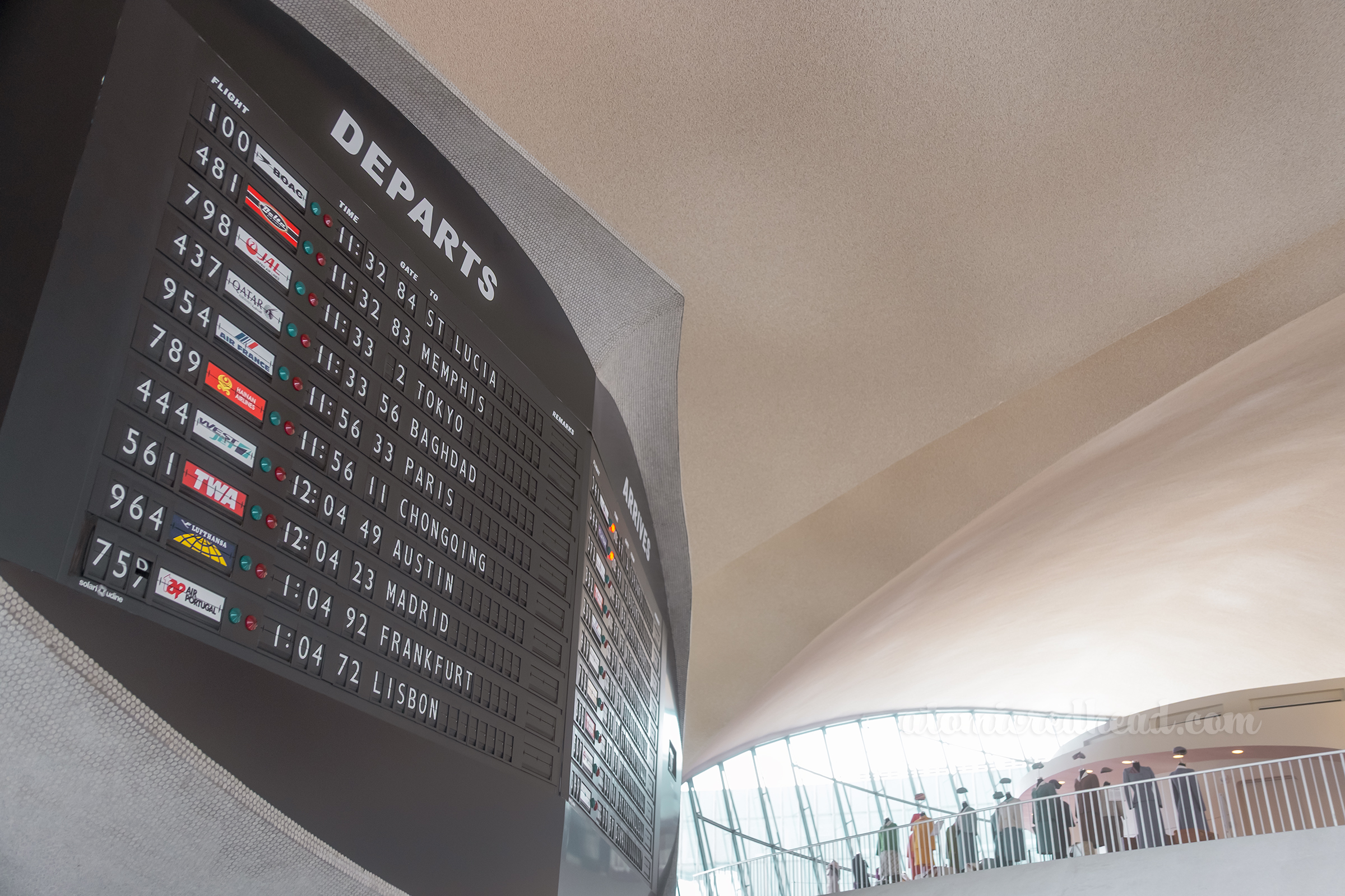 Close-up view of the sweeping curved arrival and departure and info kiosk.
