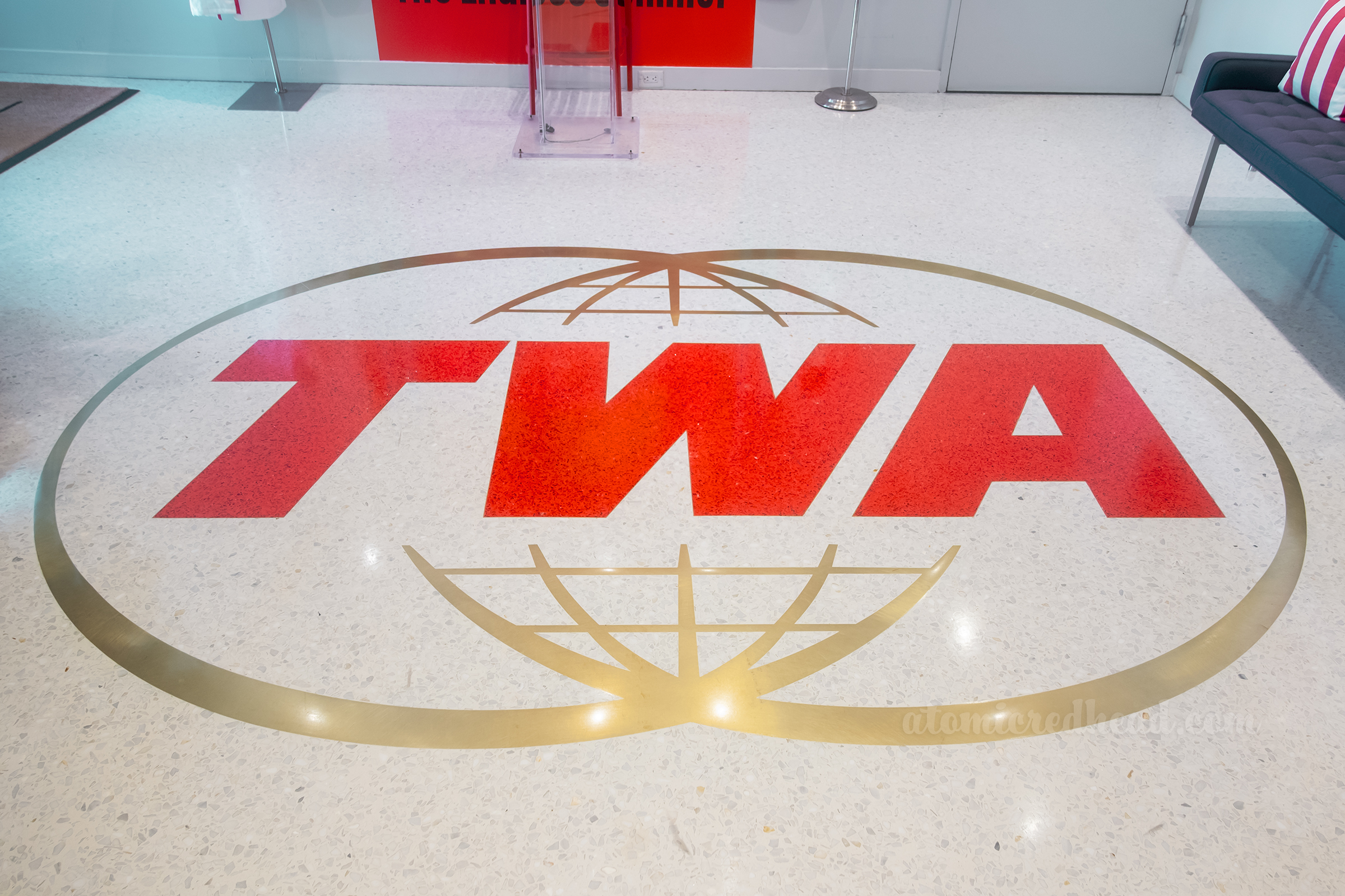 Close-up of the TWA logo on the floor.