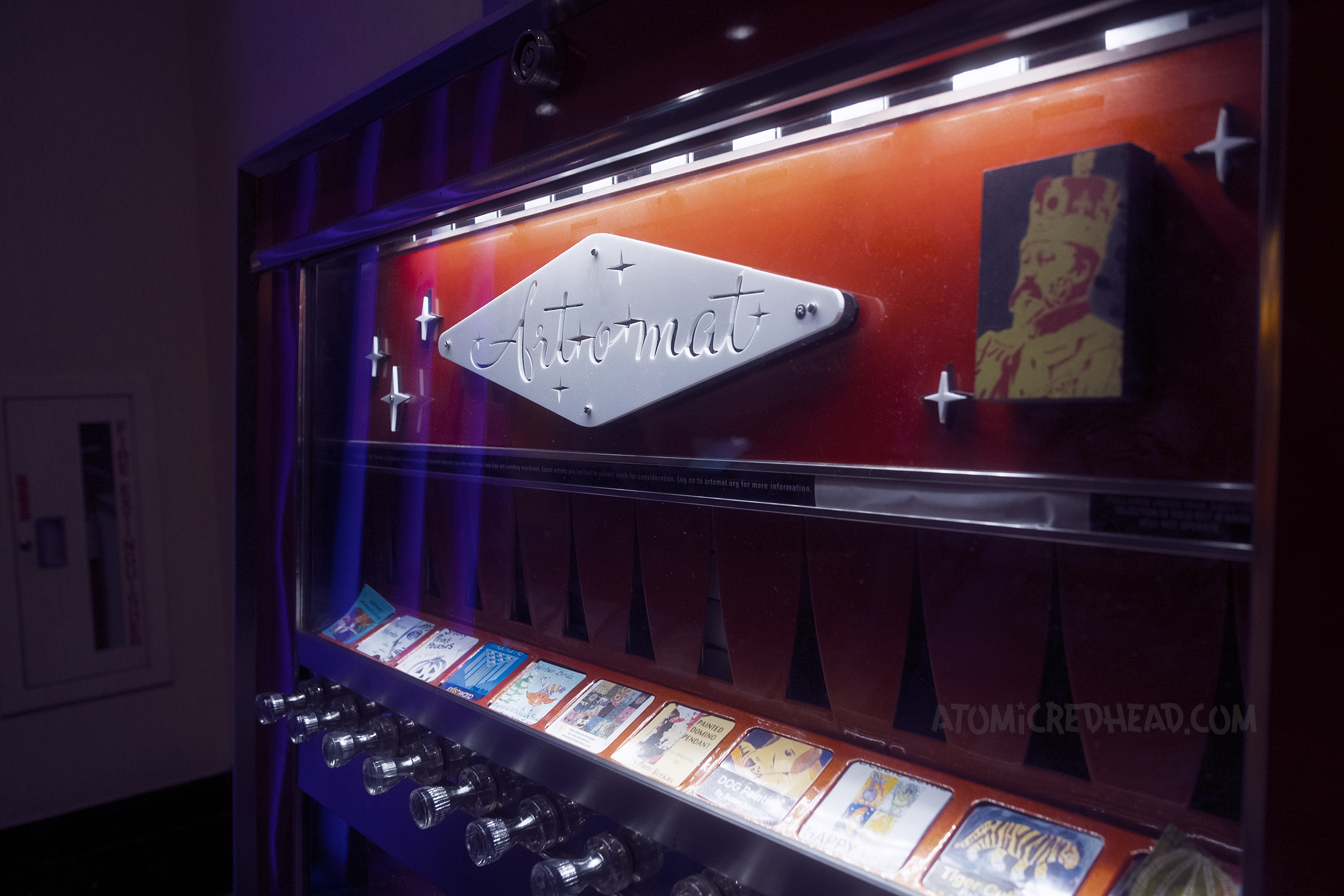 An old cigarette machine converted into an "Art-O-Mat" that holds miniature works of art.