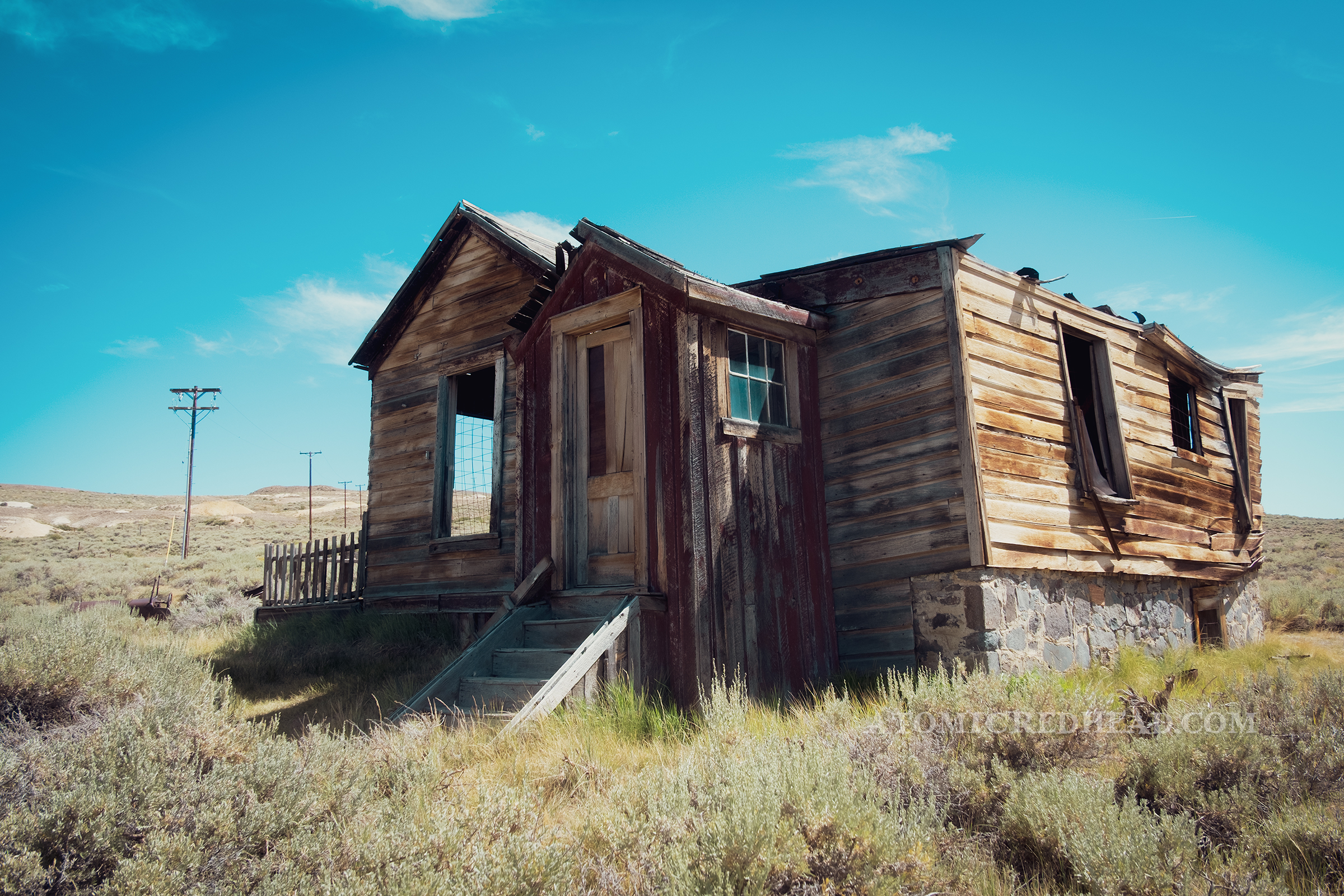 An old house fades in the sun.