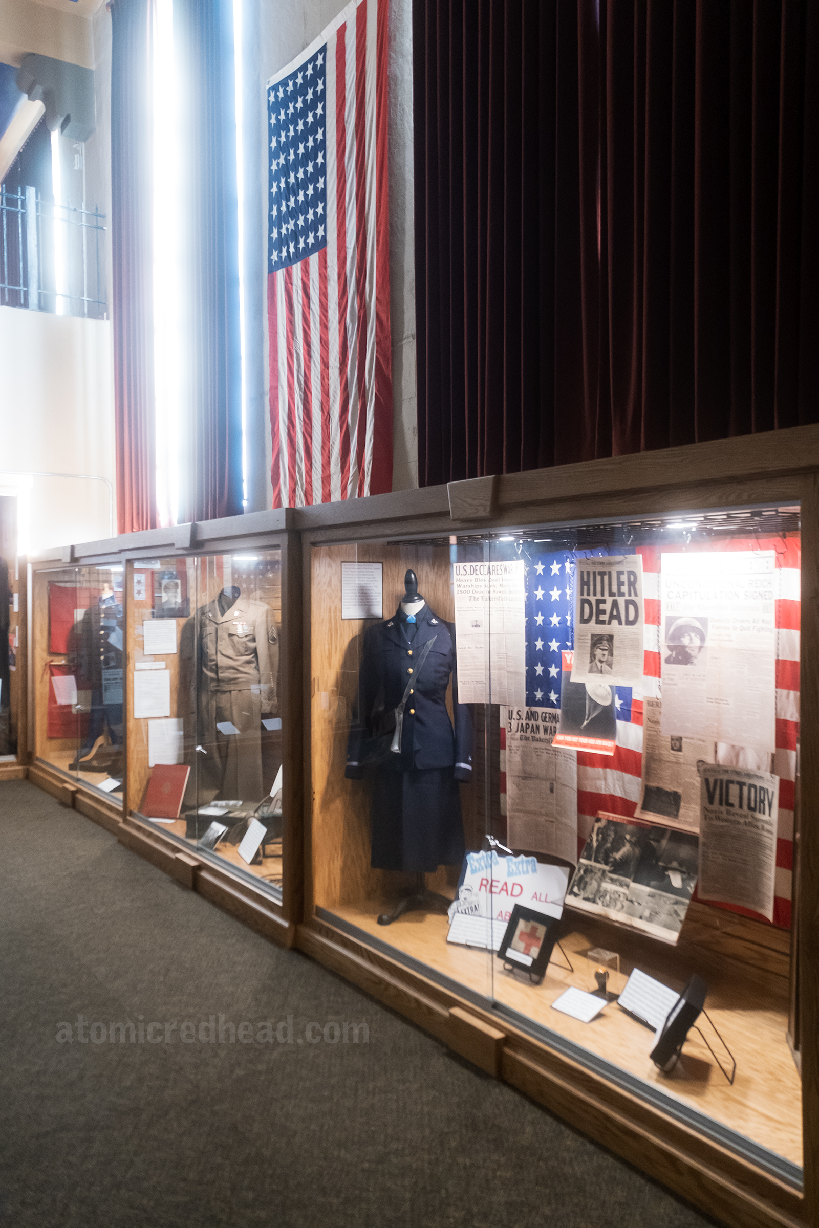 Display cases filled with uniforms from World War II.