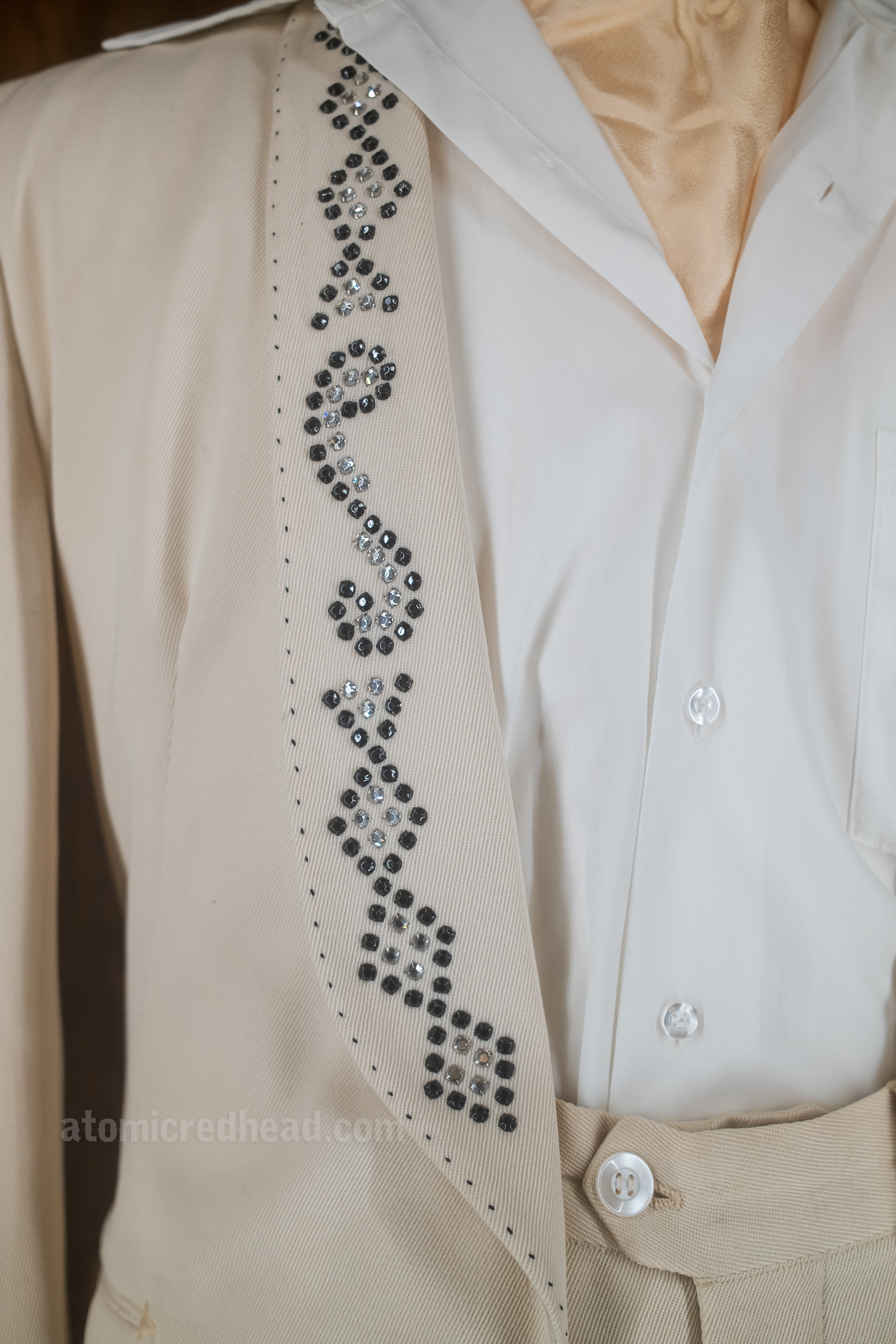 Rhinestone detail on a cream suit worn by Haggard and done by Nathan Turk.