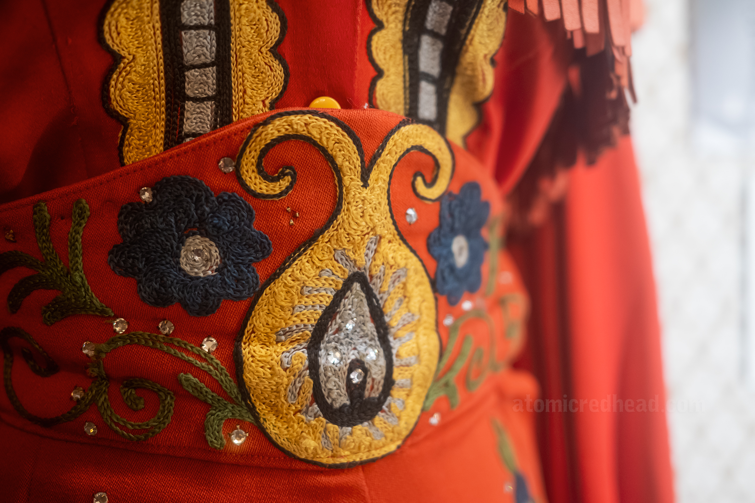 Close-up of the embroidery on a western outfit worn by Rose Maddox, made by Nathan Turk.