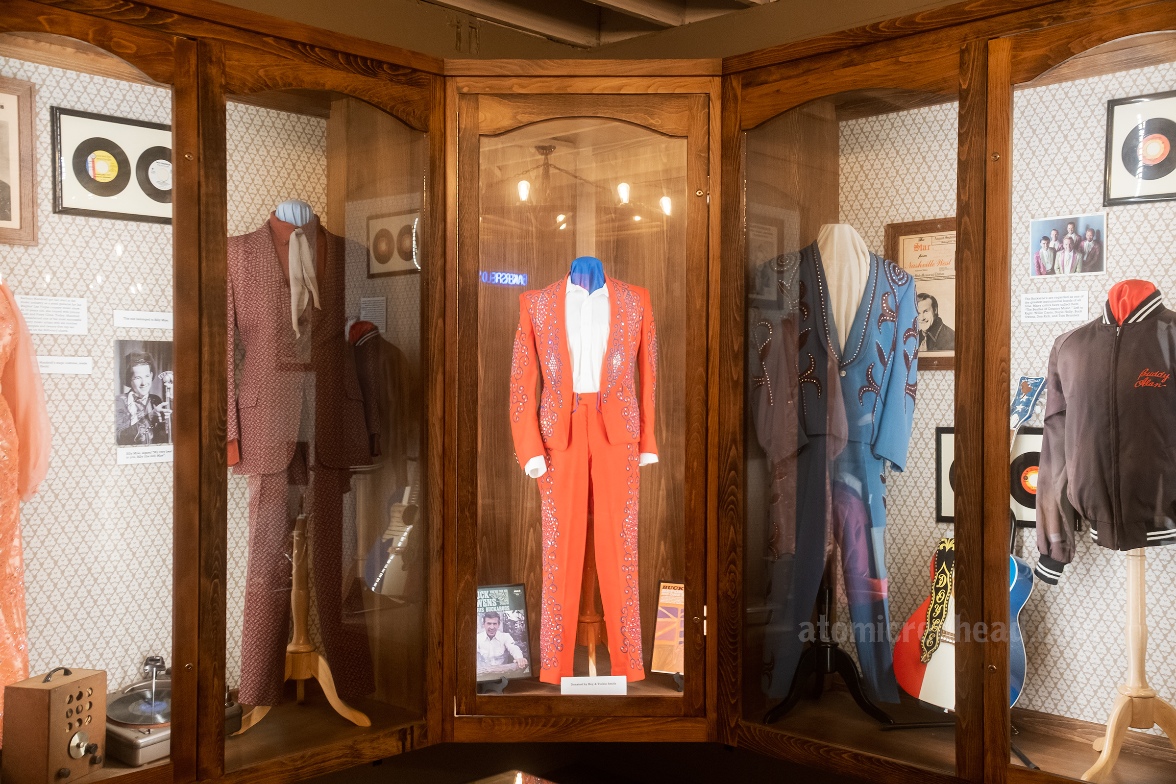 View of display cases filled with western wear.