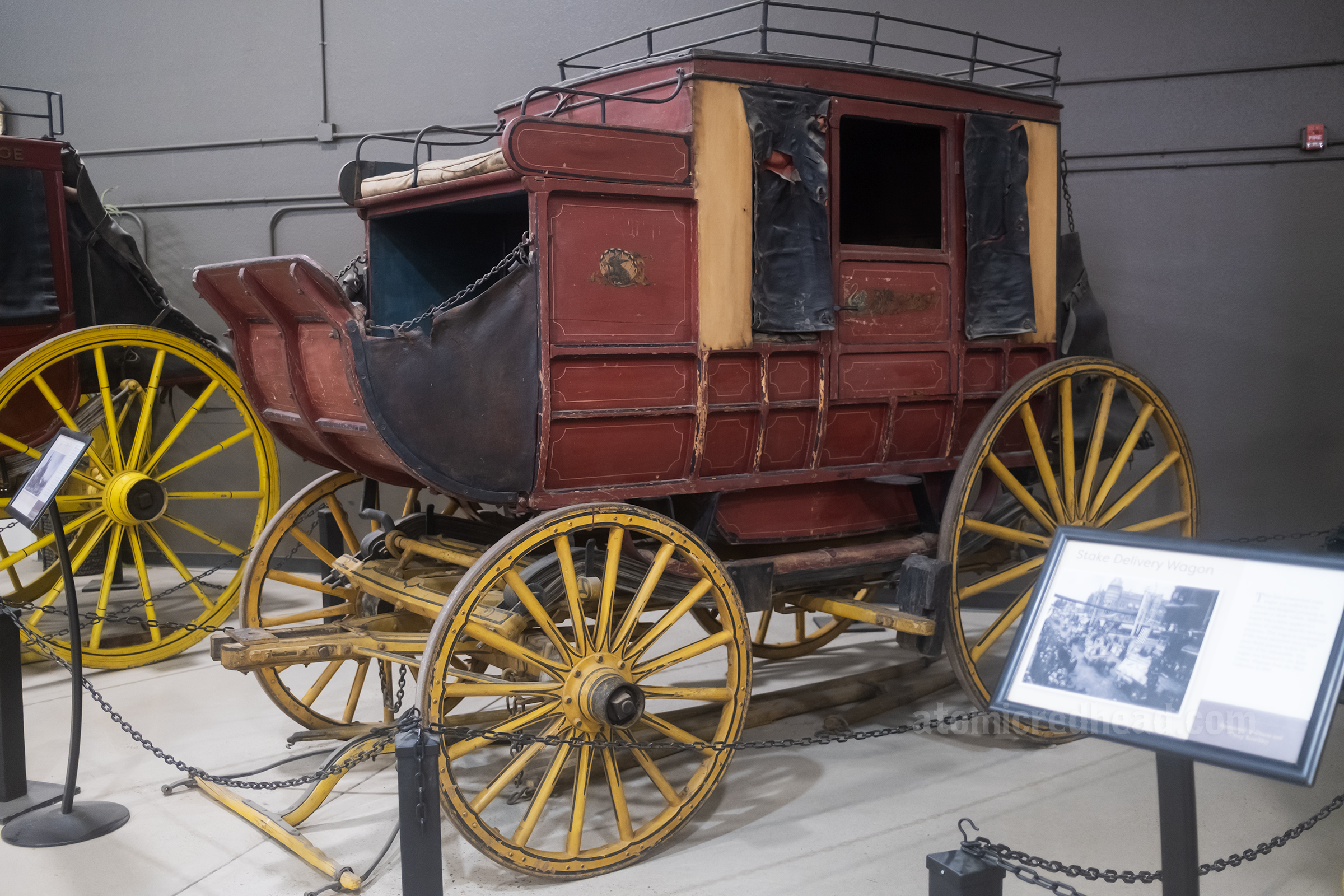 A stagecoach painted in red and yellow.
