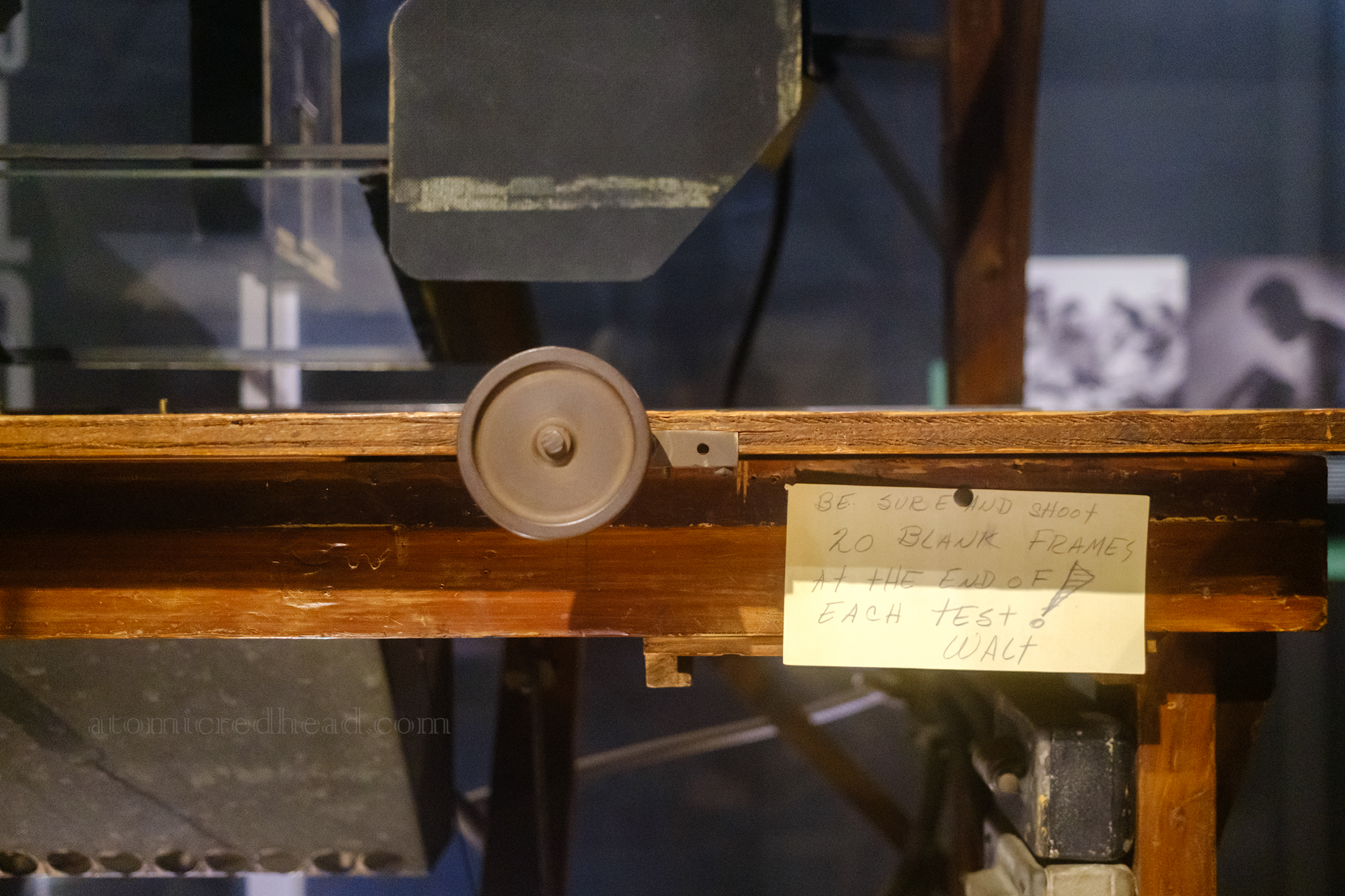Close-up of a note written by Walt Disney attached to his early animation desk, reading "Be sure and shoot 20 blank frames at the end of each test! Walt"