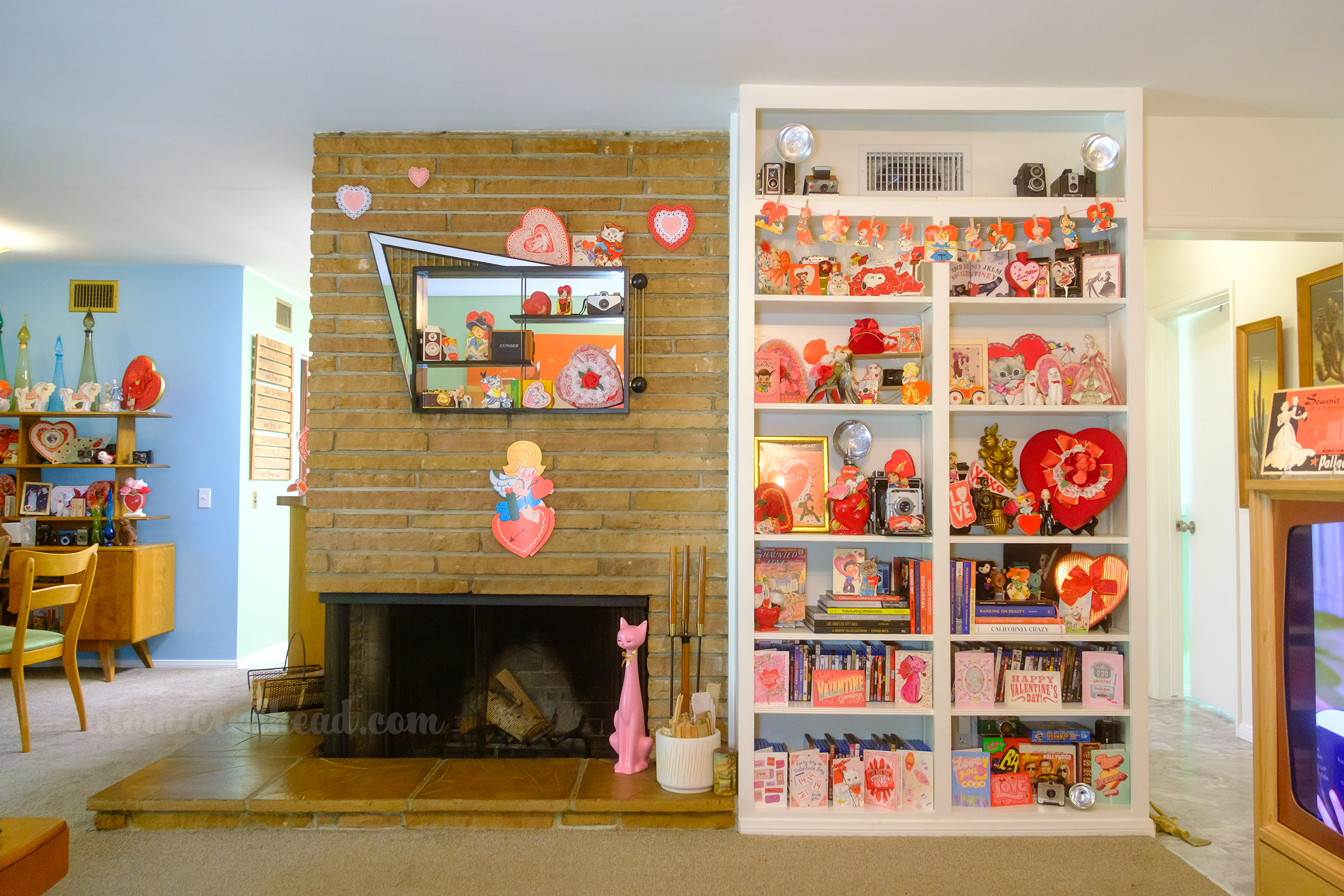 View of our built in bookcase next to our fireplace.