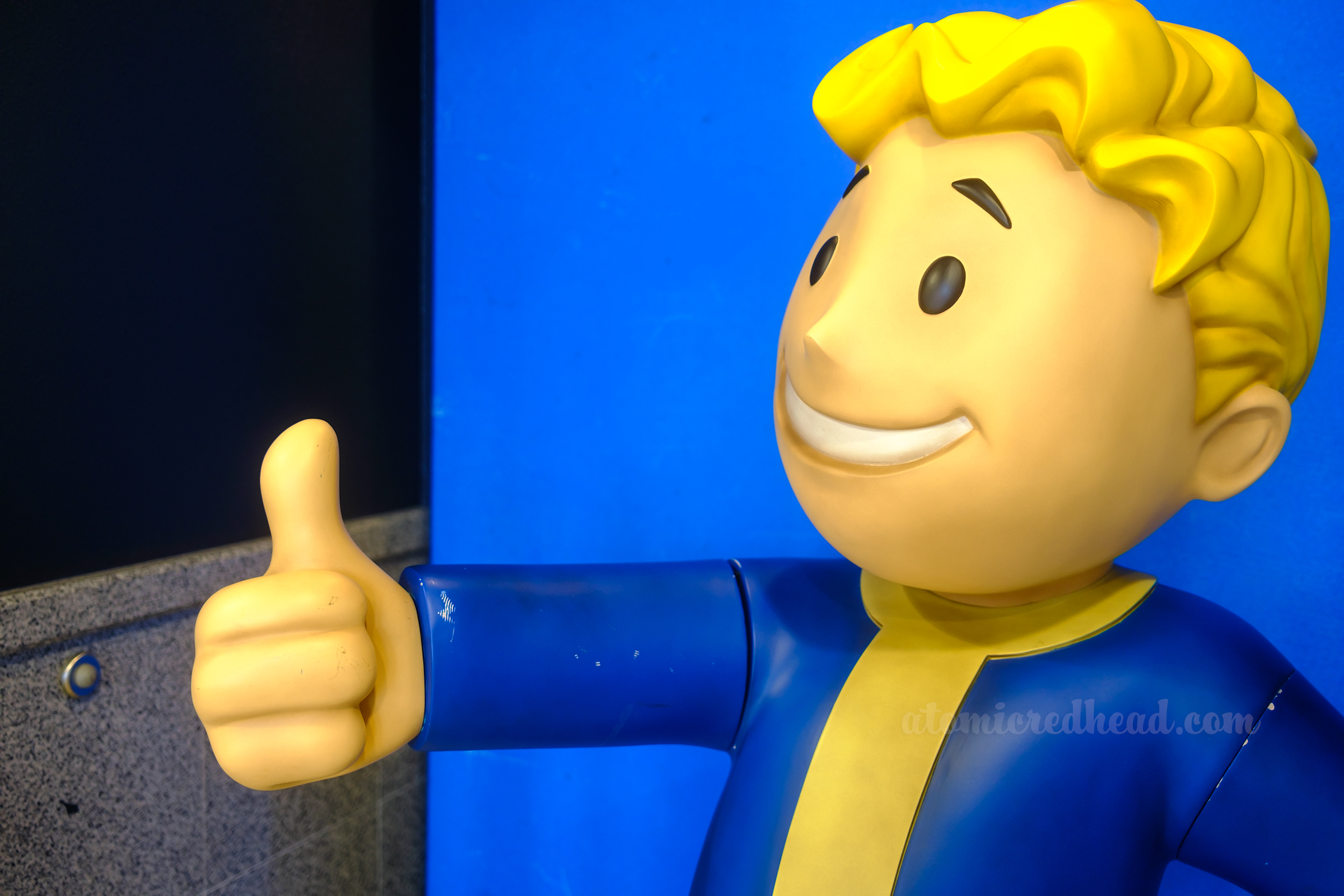 A life size Fallout Boy statue gives the thumbs up.
