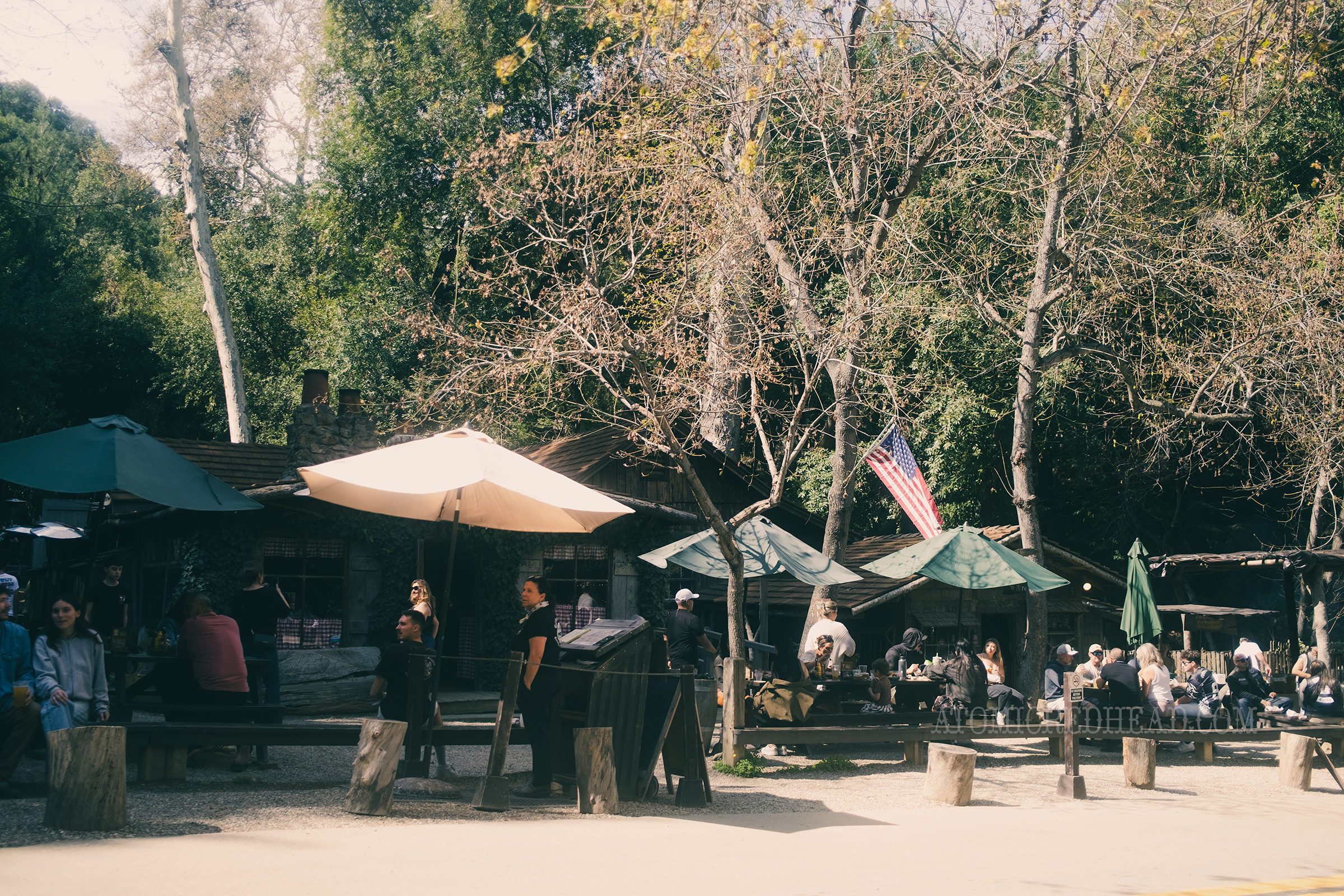 Wide exterior shot of Cold Spring Tavern with the crowds outside.