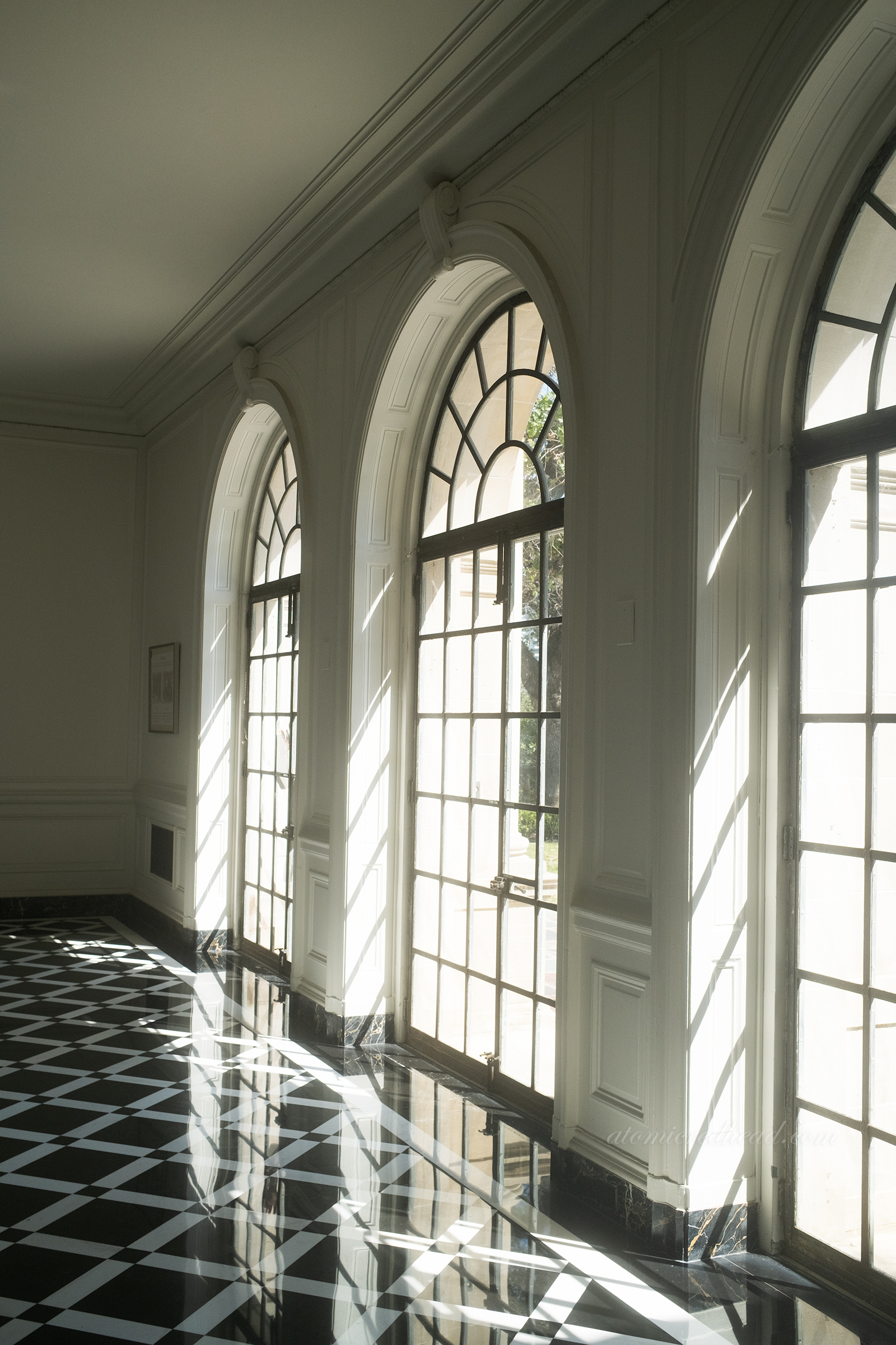 The arched windows of the card room.