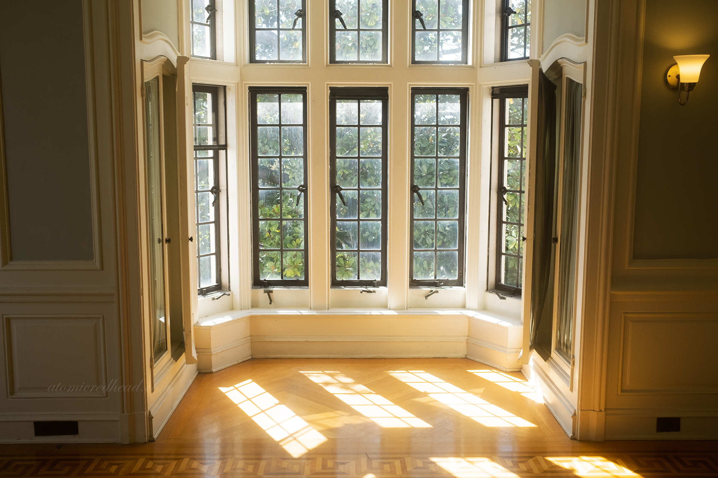 A sunlit bay window in one of the rooms.