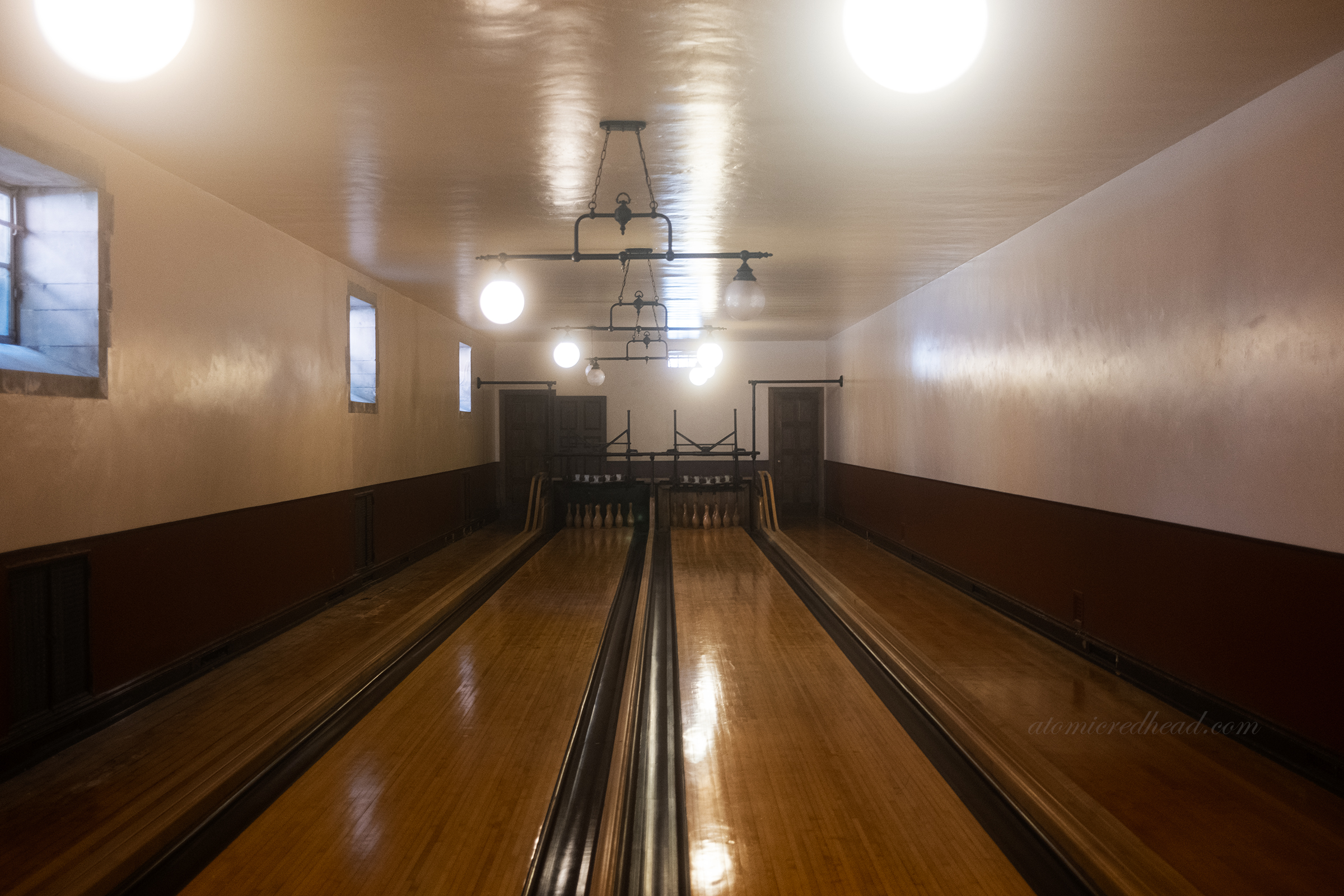 View down the two lanes of the bowling alley.
