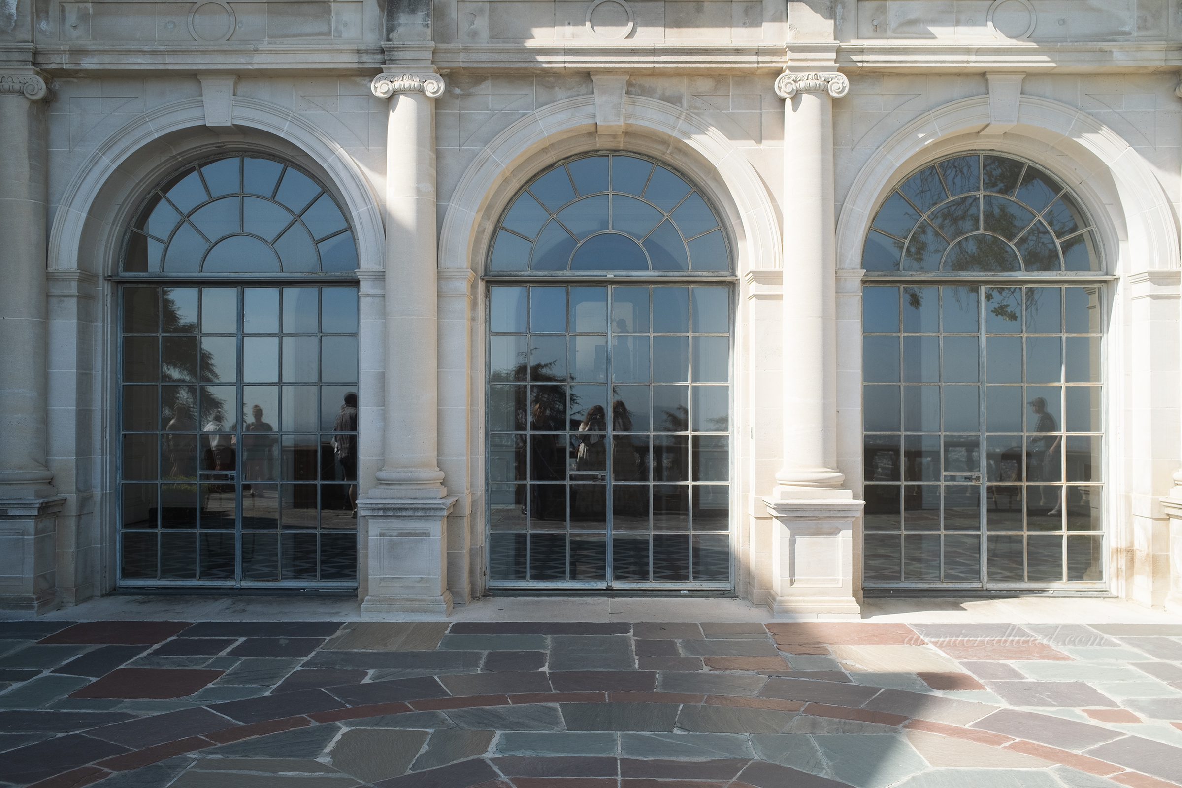 the arched windows of the card room as seen from the outside.
