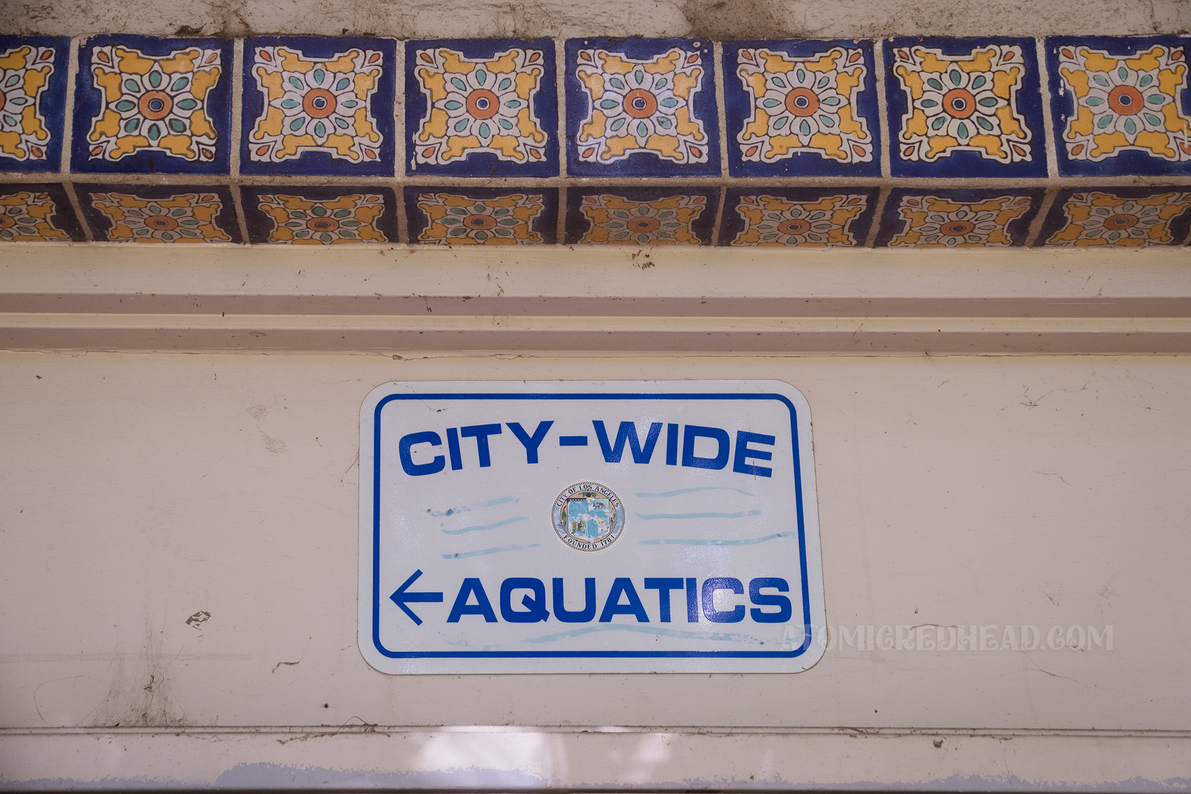 A blue and white sign reads "City-Wide Aquatics"