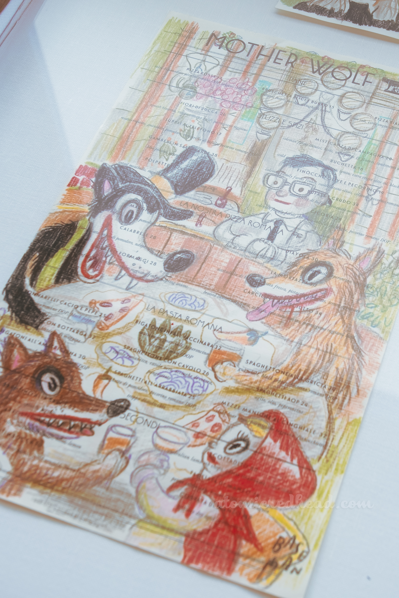 One of Baseman's works, this one features features multiple wolves and Little Red Riding Hood dining together.