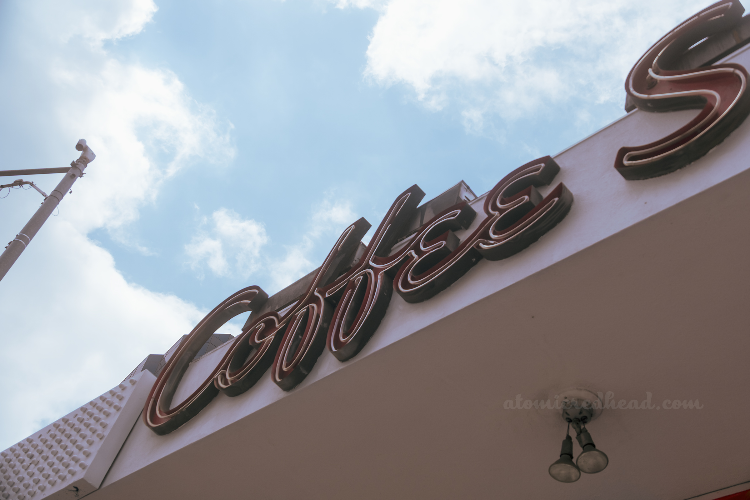 Close-up of the red "coffee" neon.