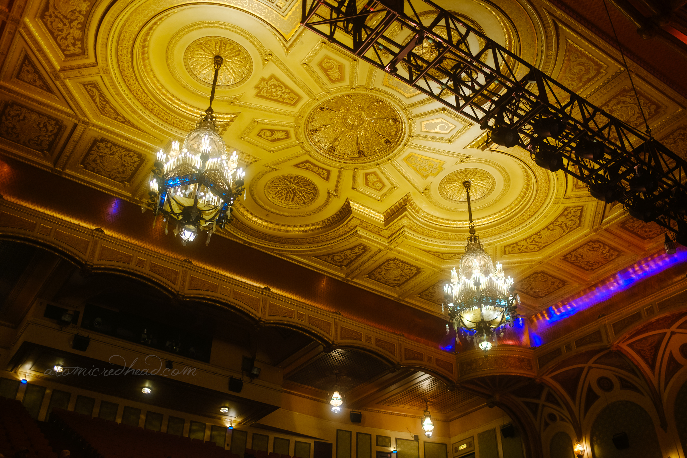 View of the two ornate chandeliers hanging in the auditorium. 