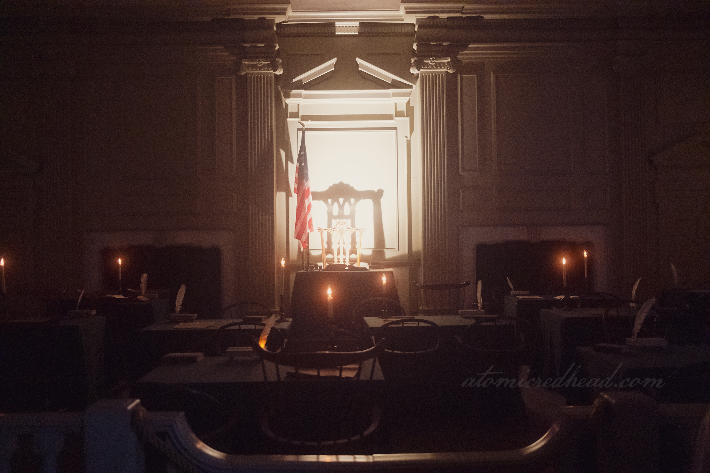 Dimmed lights give a dramatic effect to the signing room.