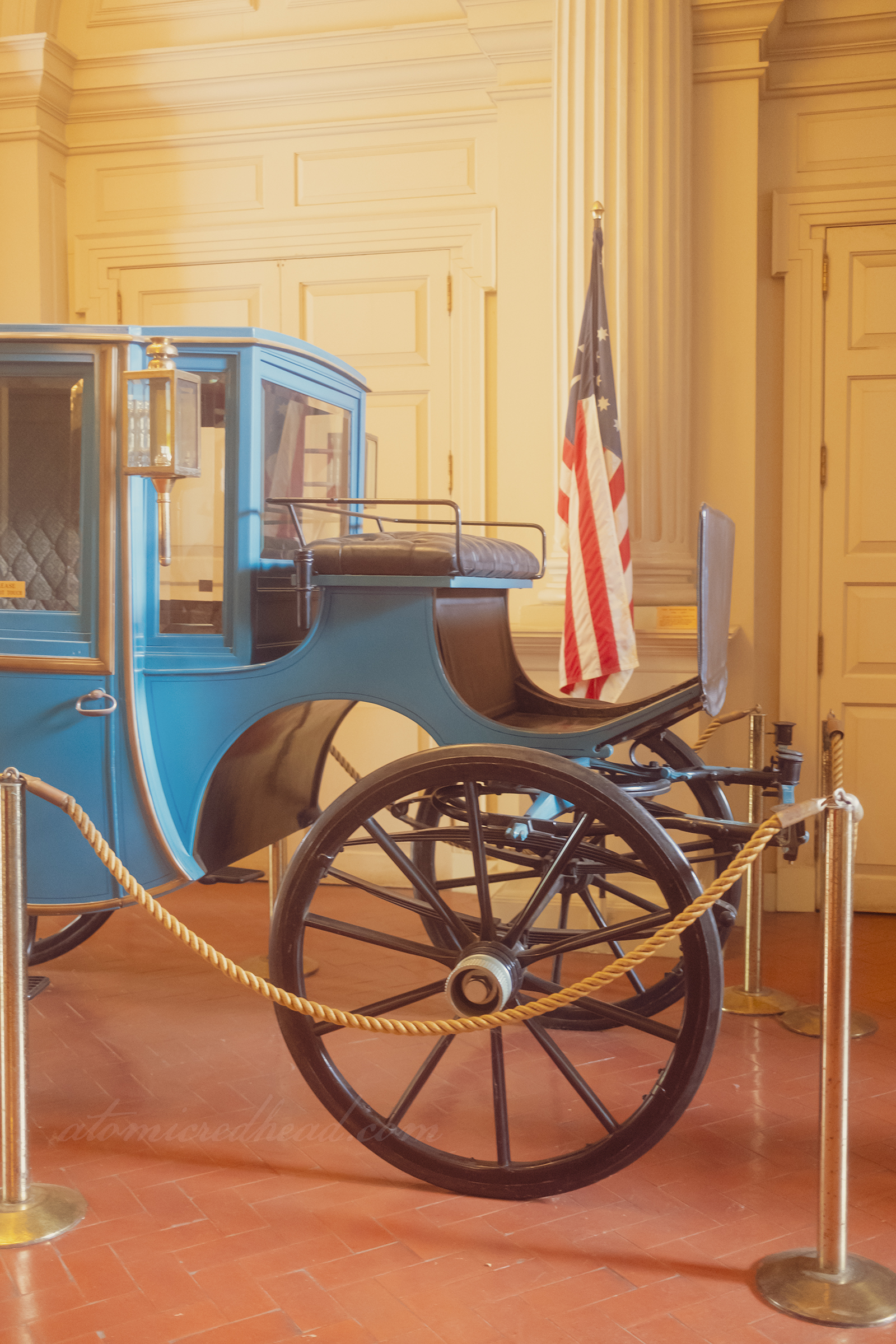Close-up of the horse drawn coach that sits inside.