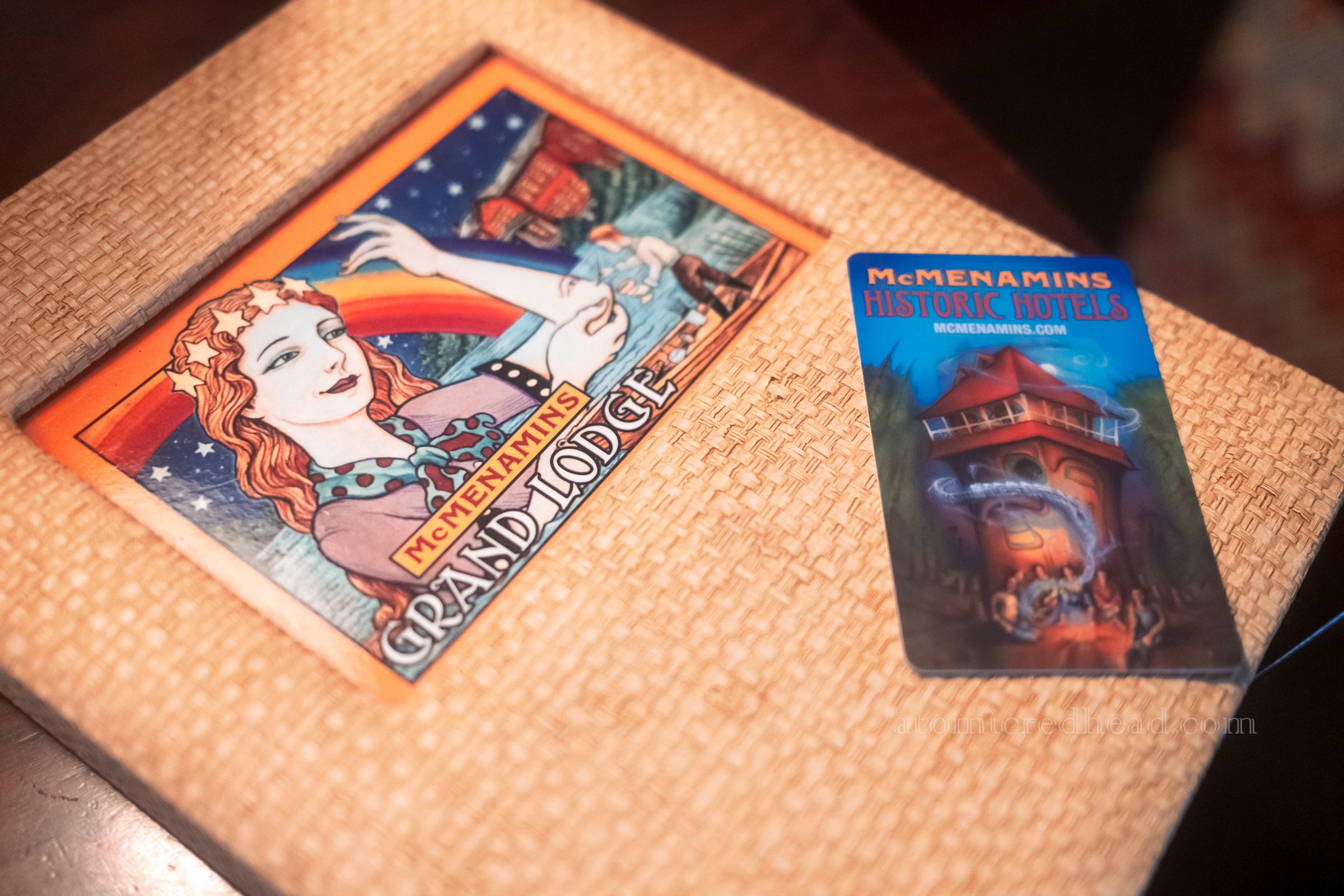 Close-up of the whimsical guide book and room key.