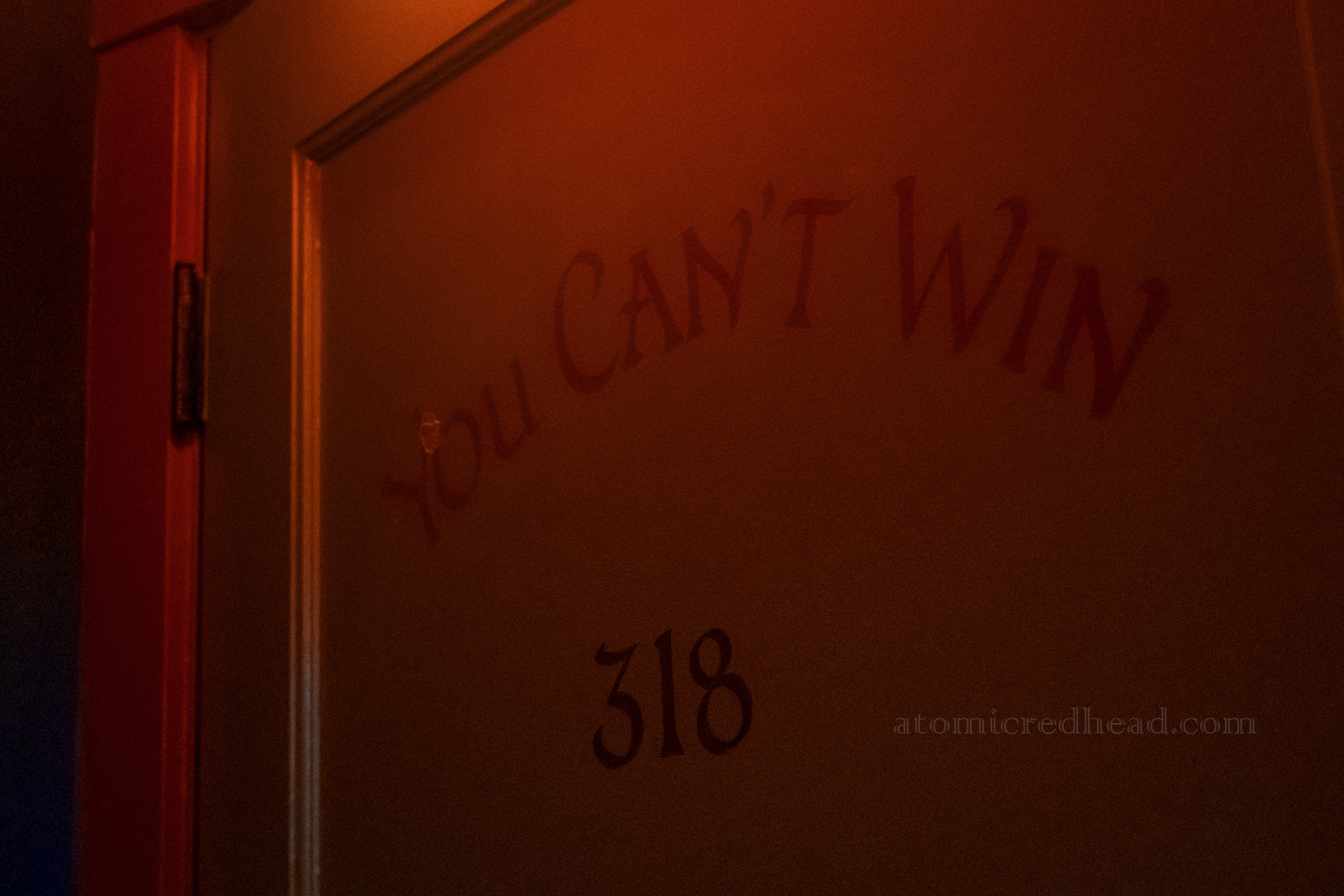 Close-up of the door to our room called "You Can't Win"