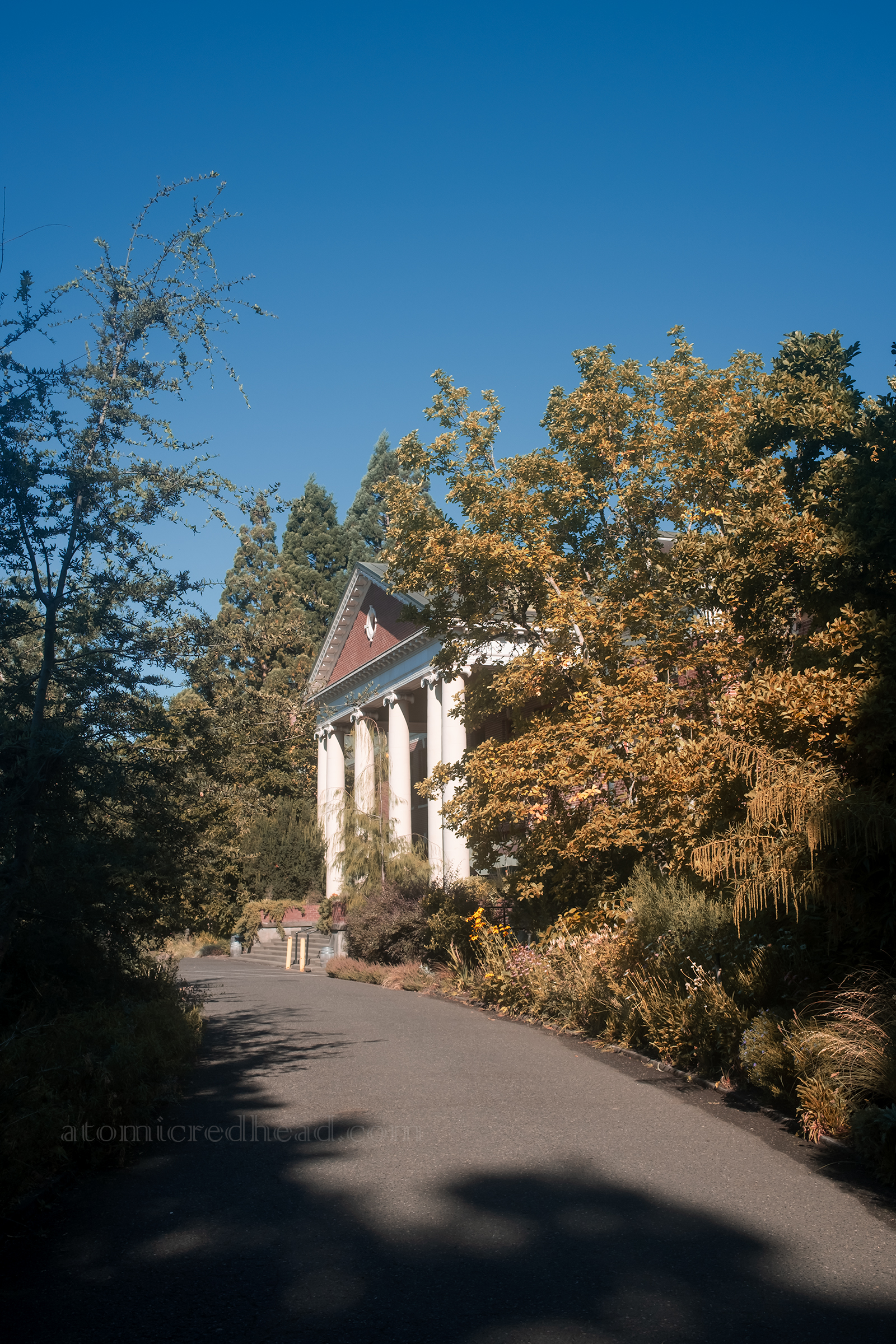 Exterior of Grand Lodge, a Greek revival style portico with columns, with the building itself made of brick.