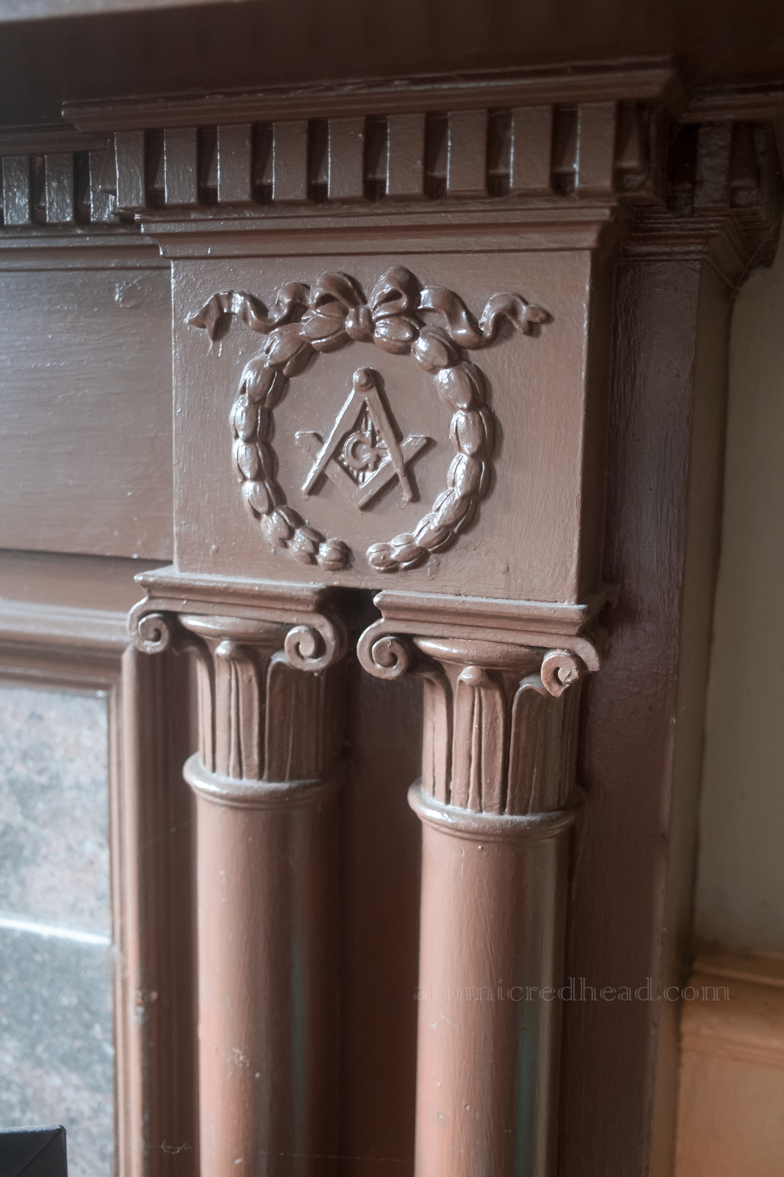Freemason symbol carved into the fireplace.