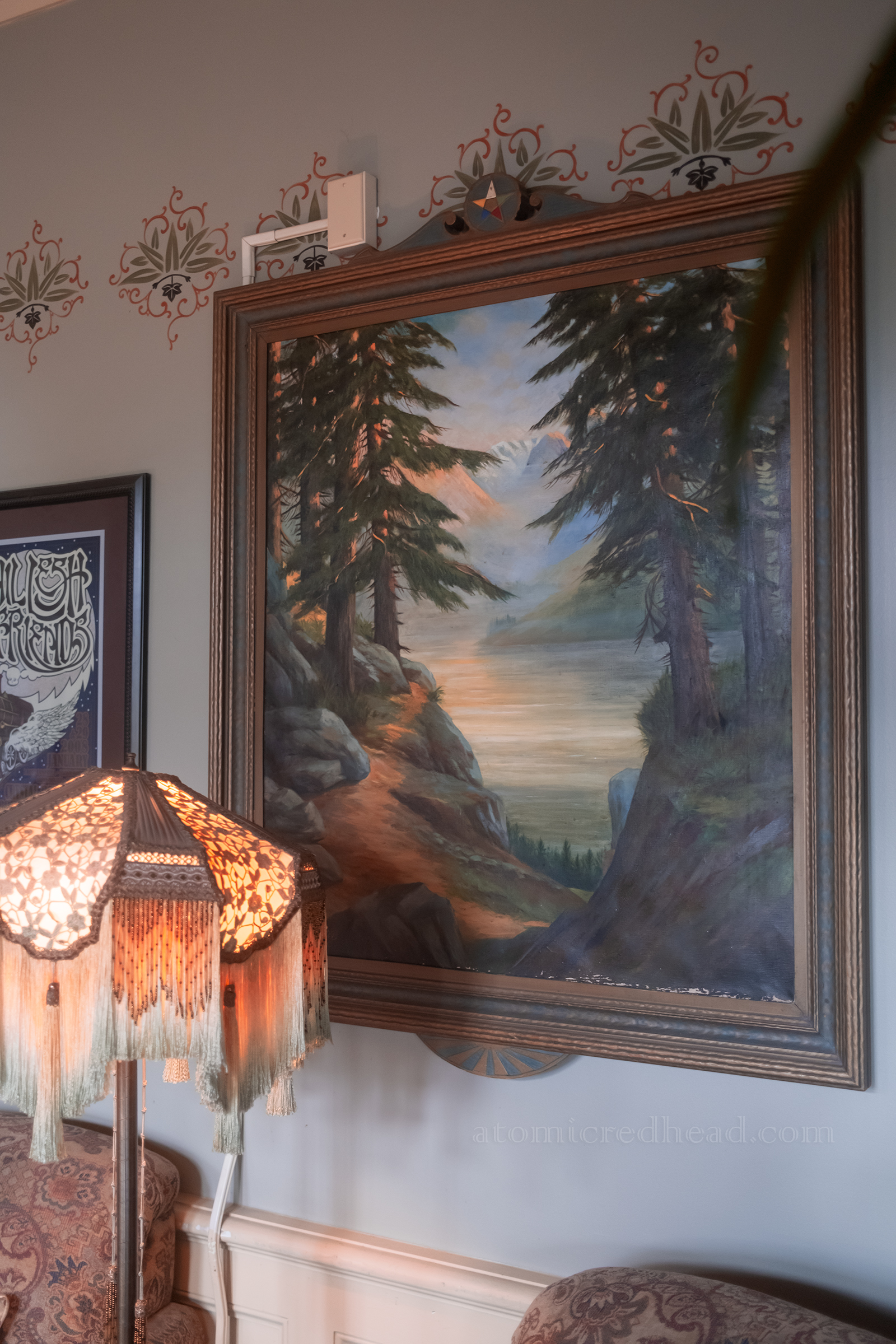 A painting of evergreens in the lobby.