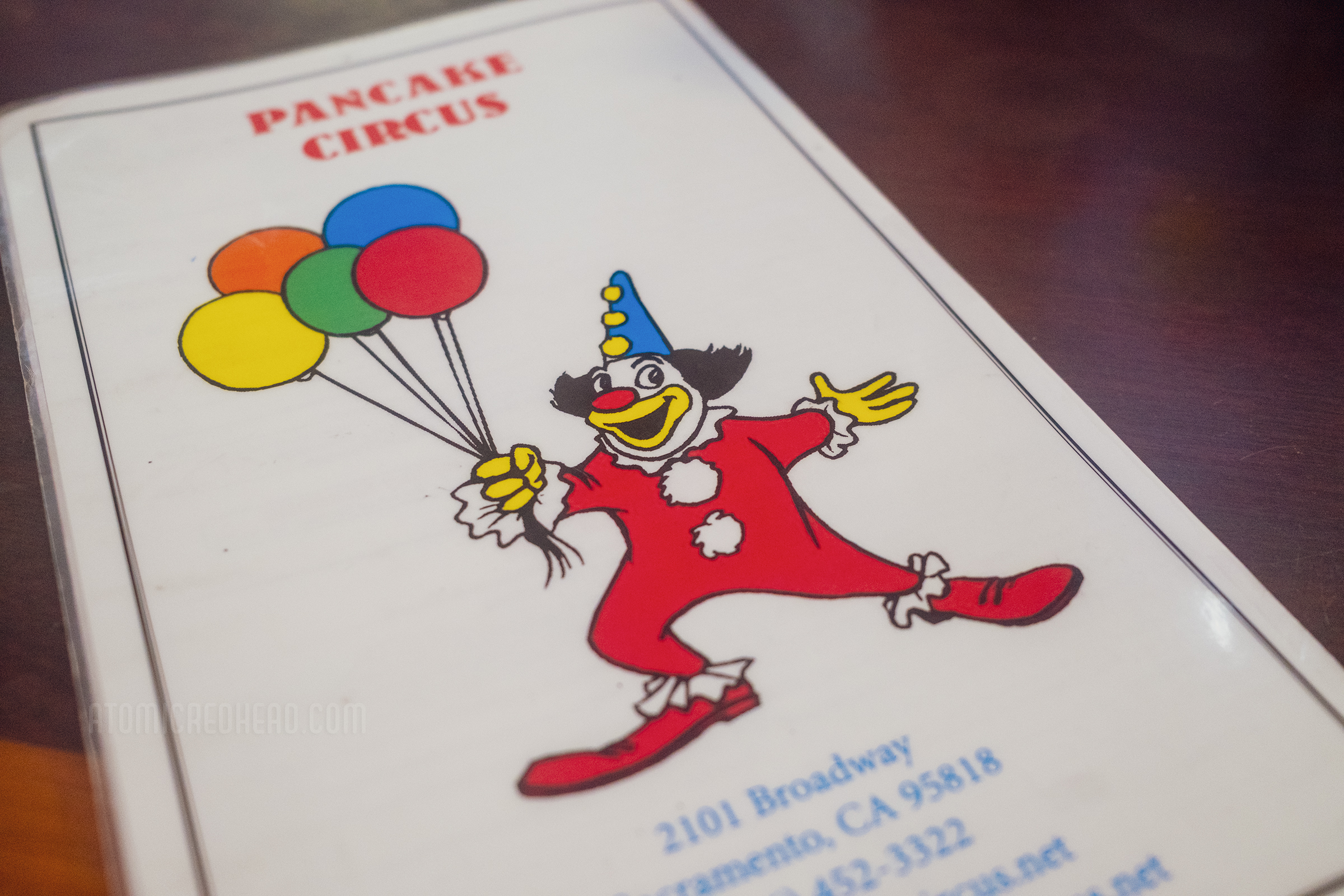 The menu, featuring a clown with balloons.