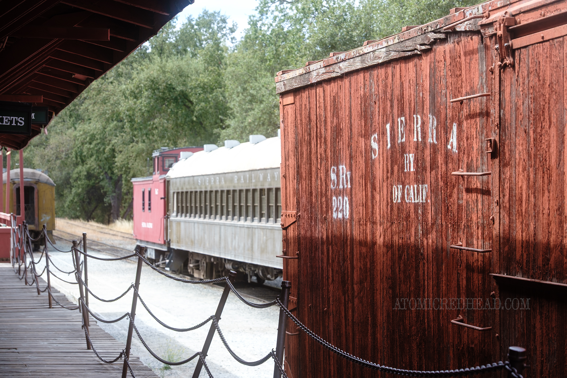 A cargo car rests just outside the depot.