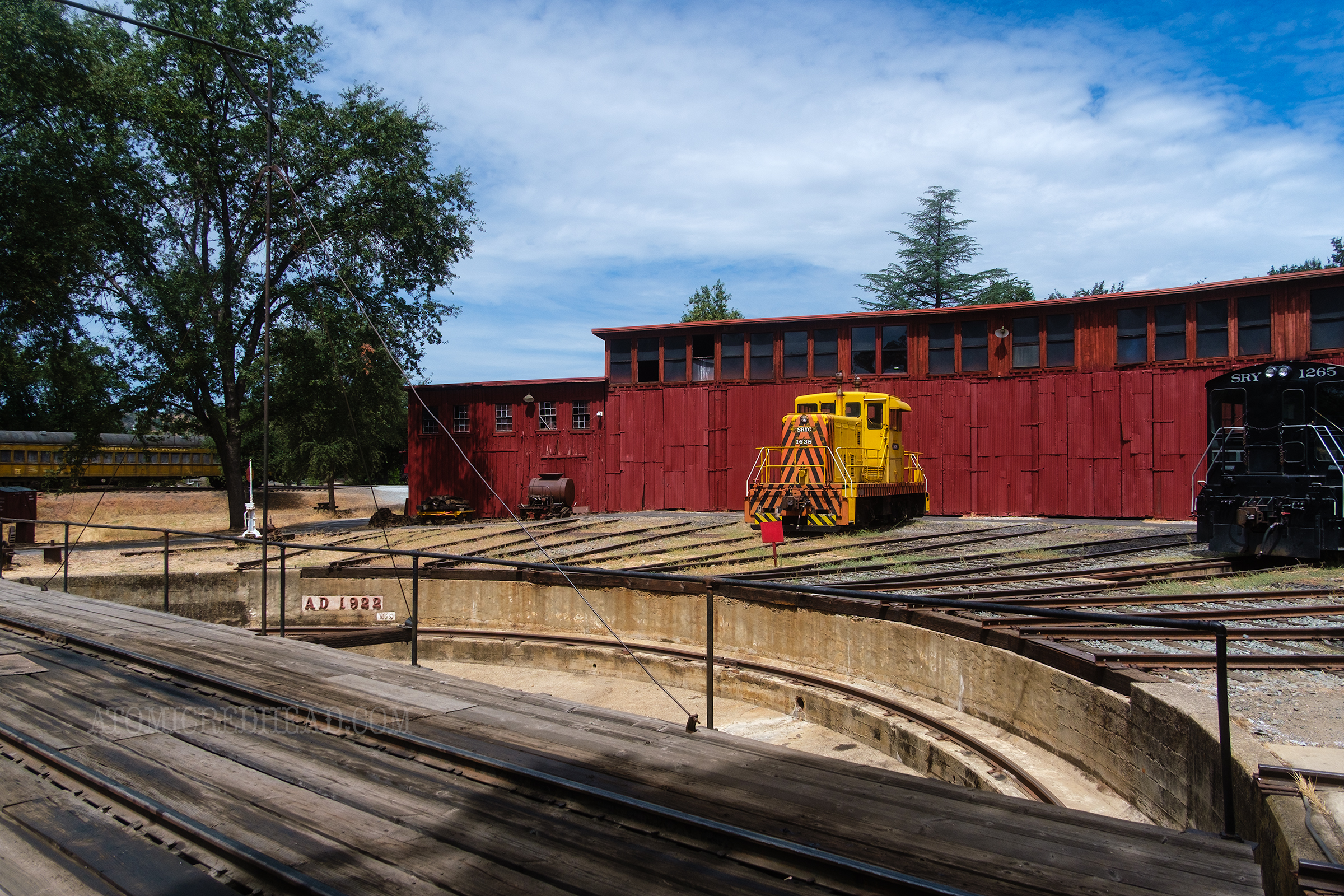 View of the roundhouse, a red curved building used to house the trains.