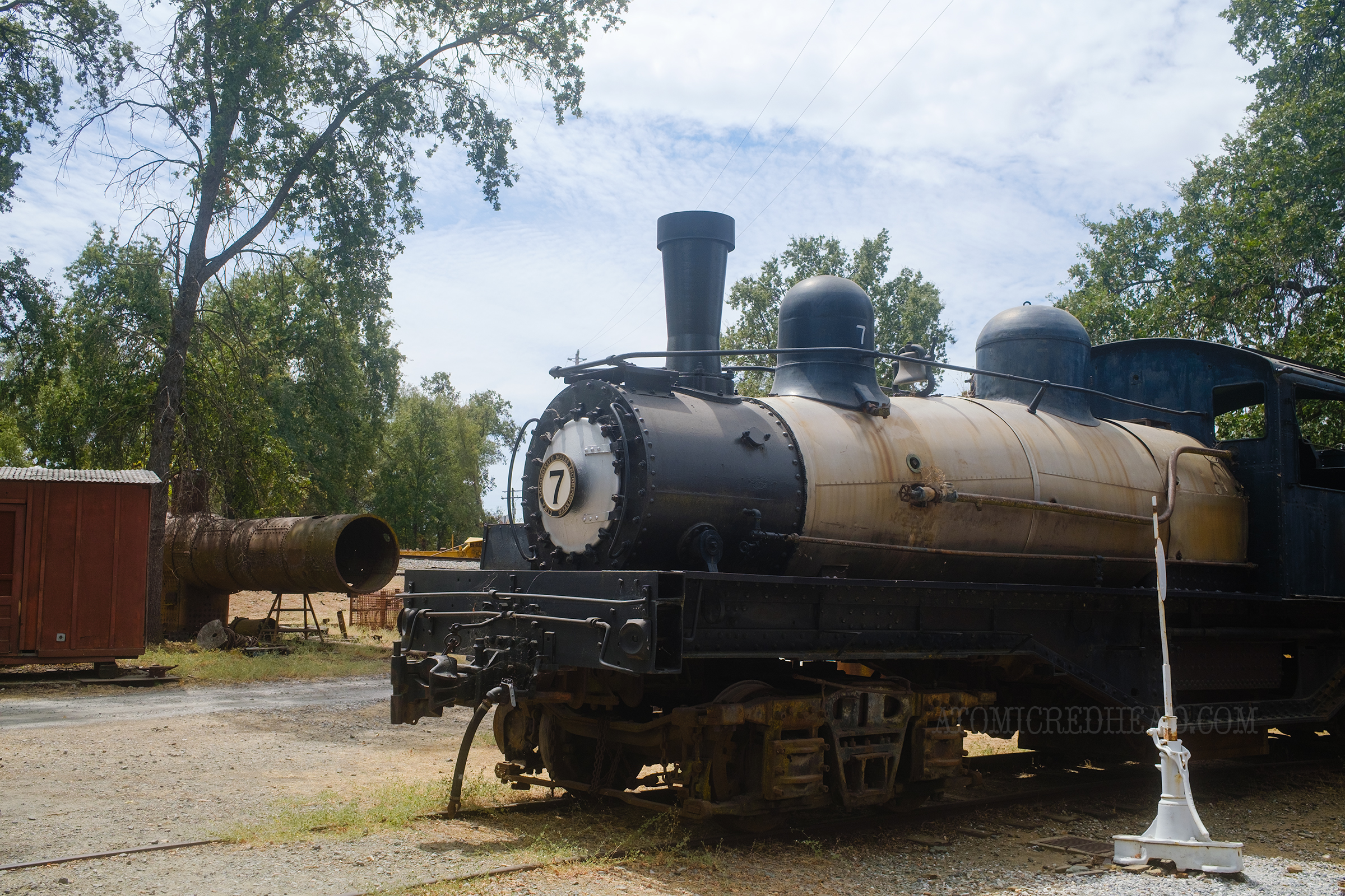 A locomotive sits outside.