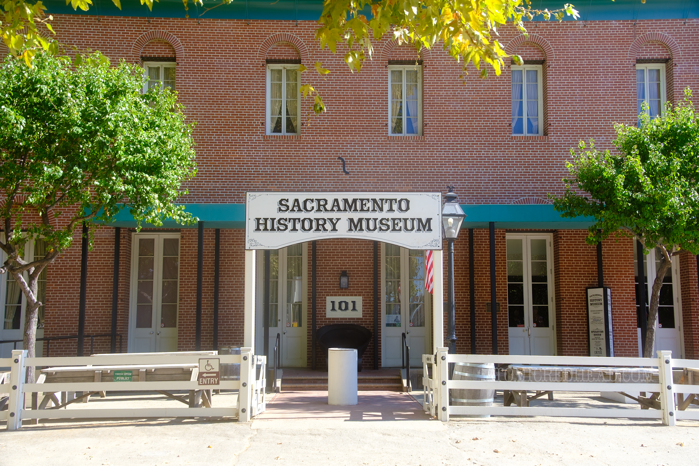 Exterior of the Sacramento History Museum, a two story brick structure in a simple style.