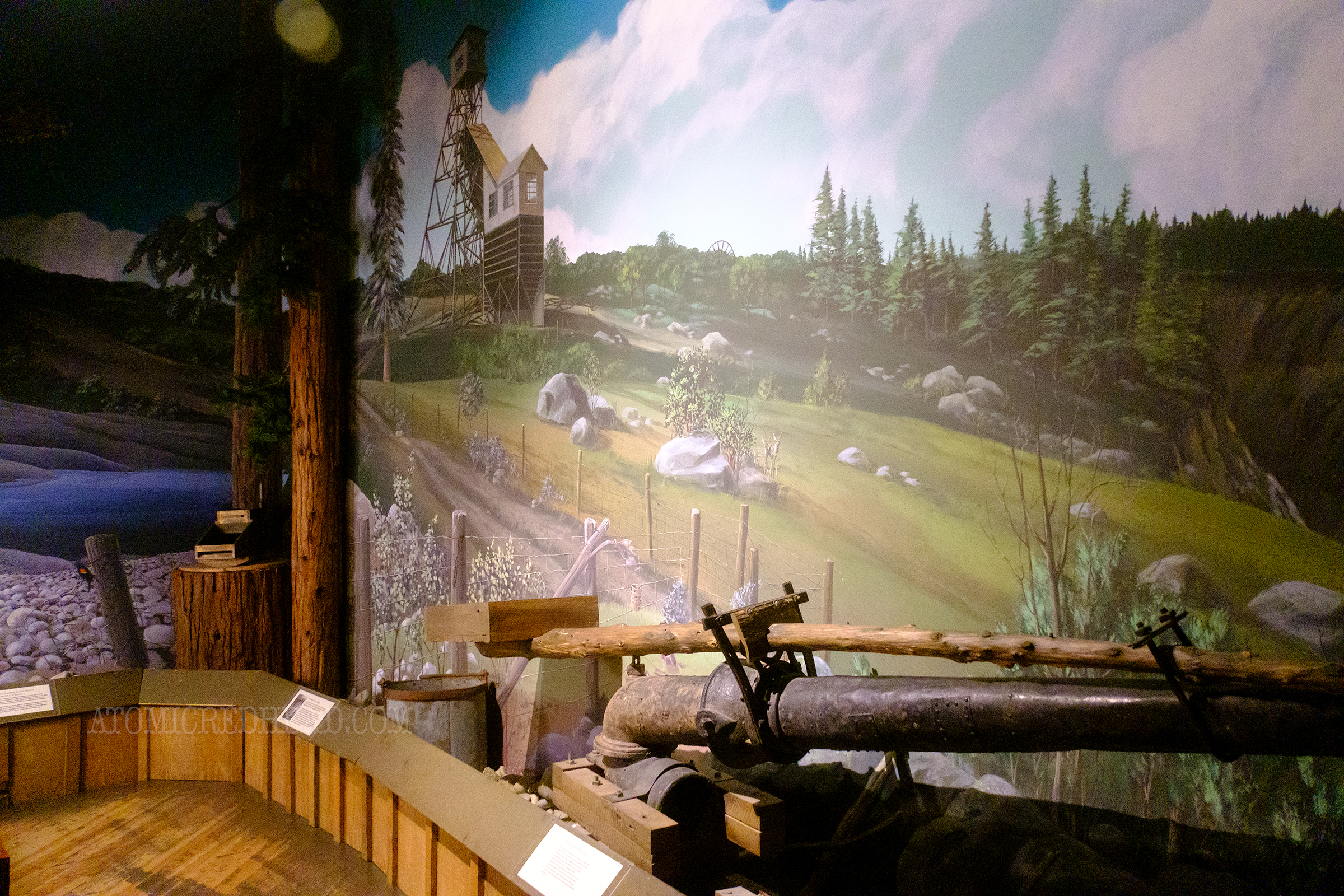 A mural showing a stamp mill for mining.
