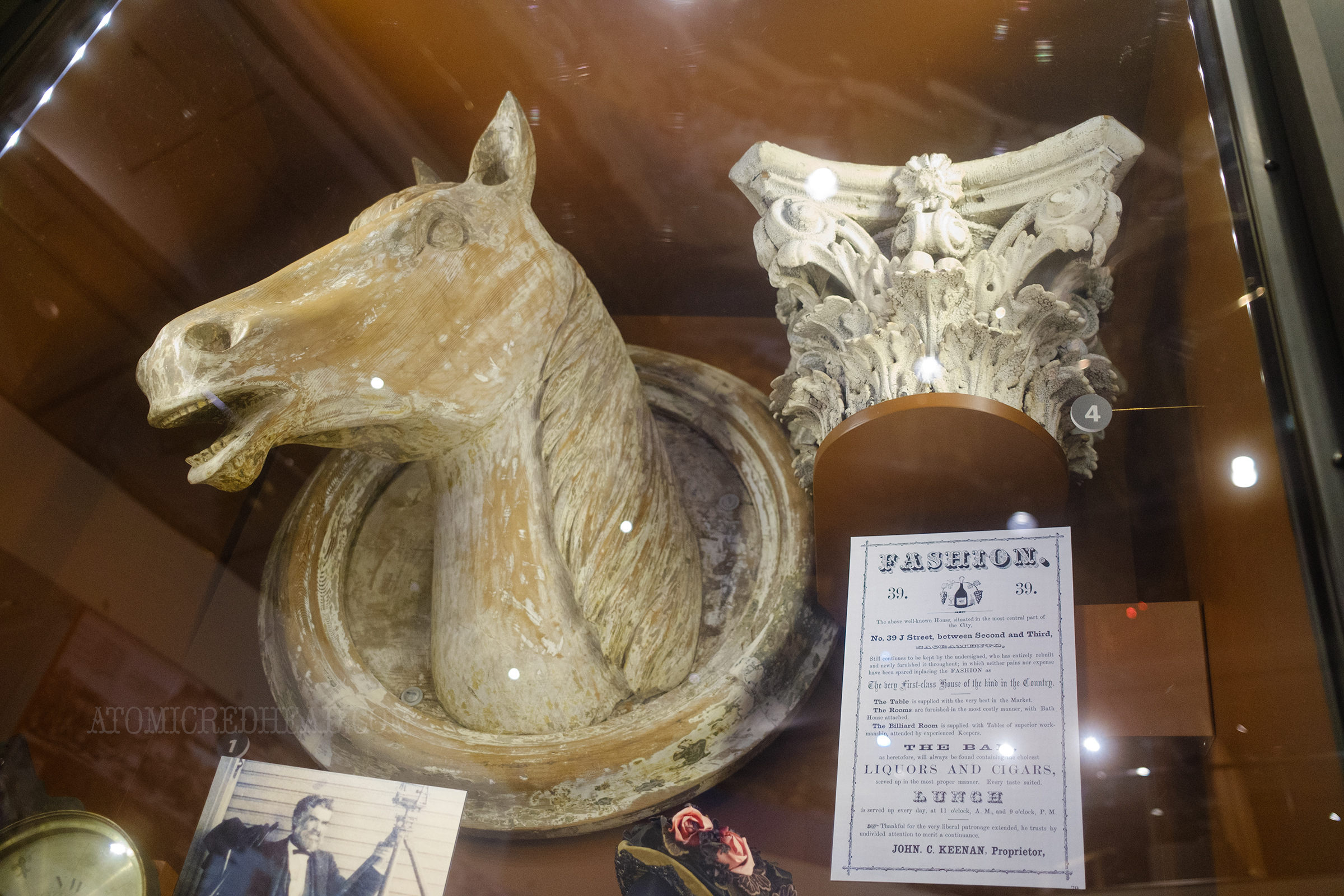 A carved wooden horse head that once adored a saddle shop, an a cast iron capital from a saloon.