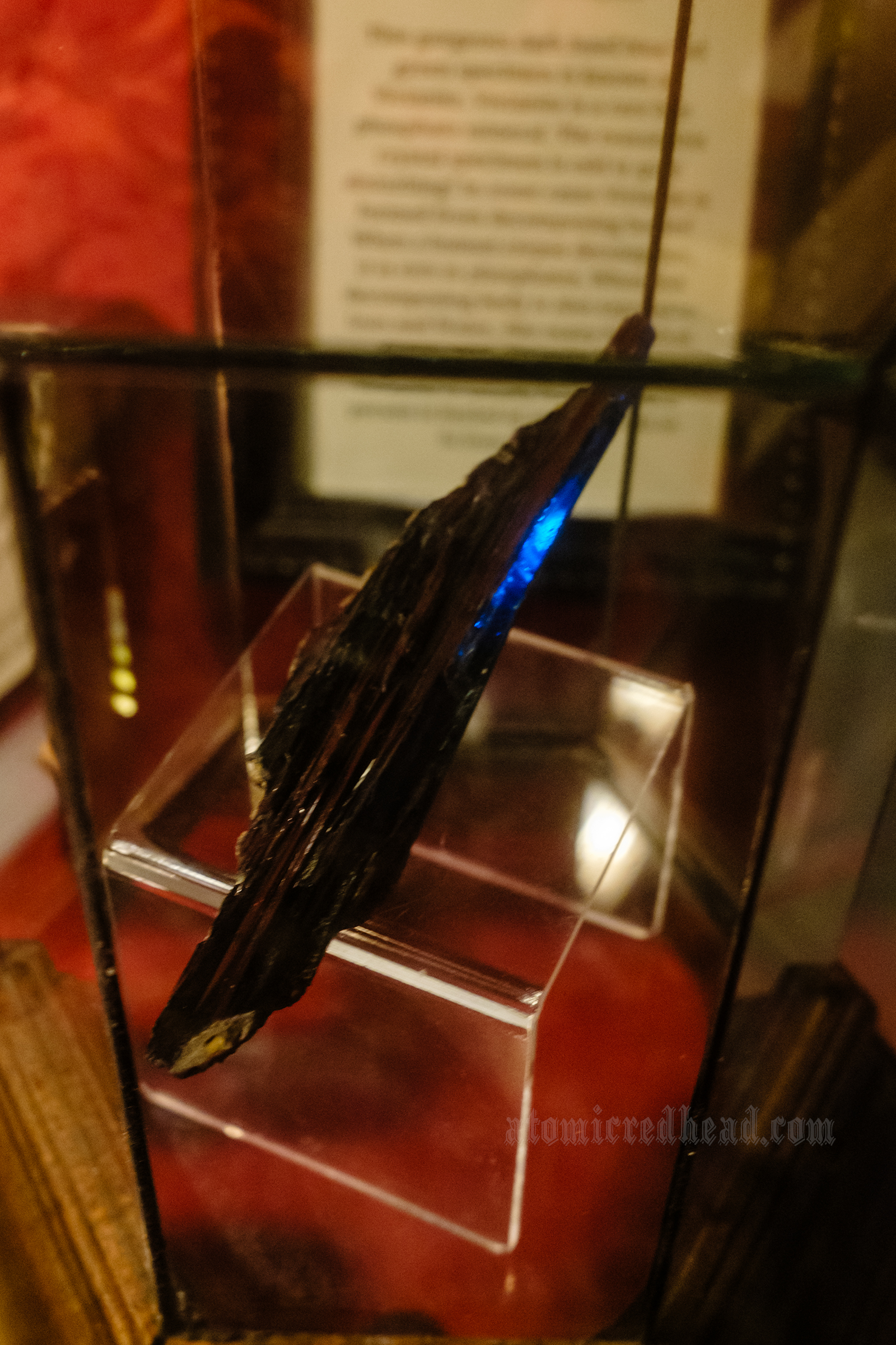 A long jagged piece of a black material known as vivianite.
