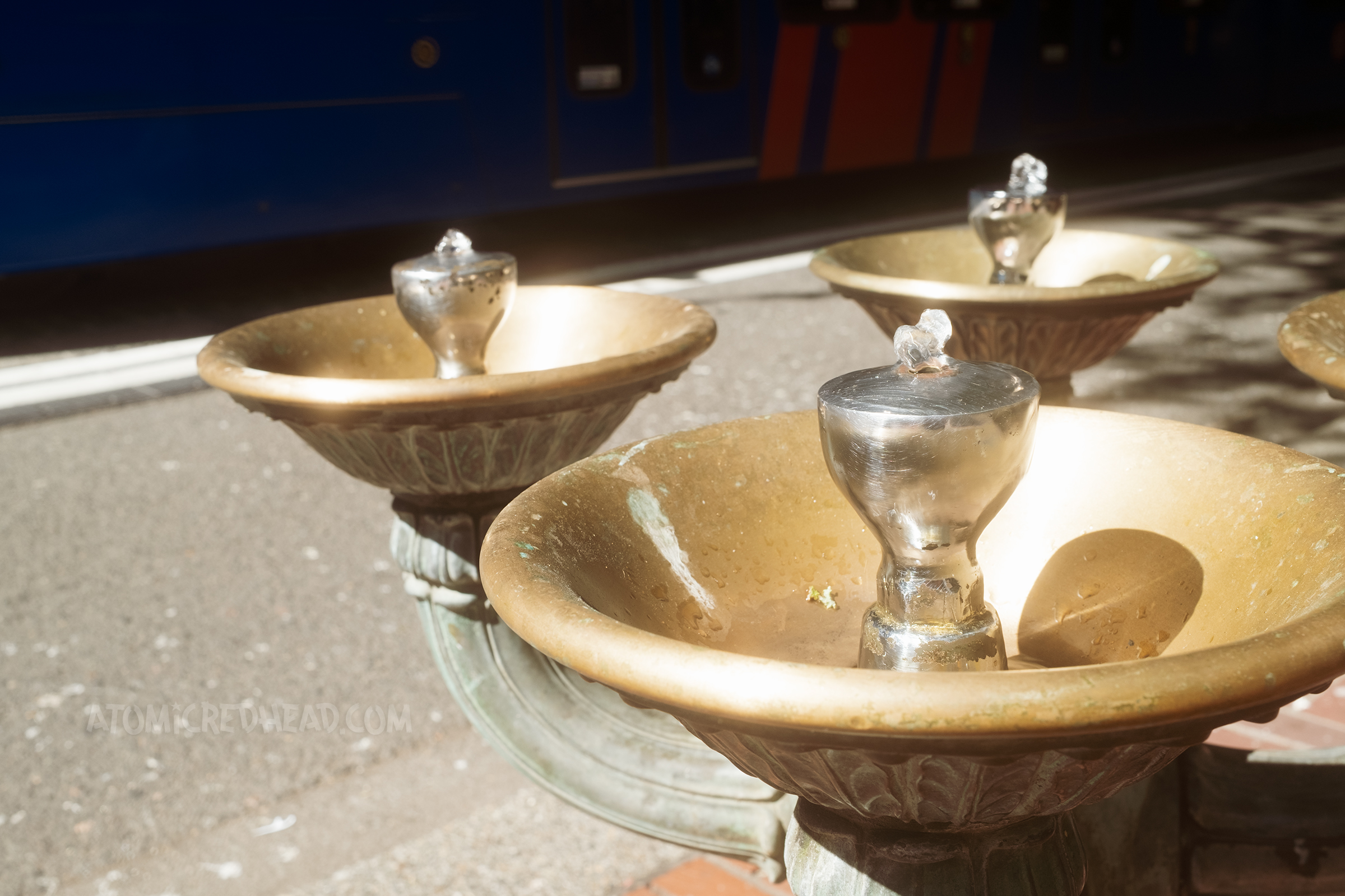 Three miniature fountains have water "bubble" from them.