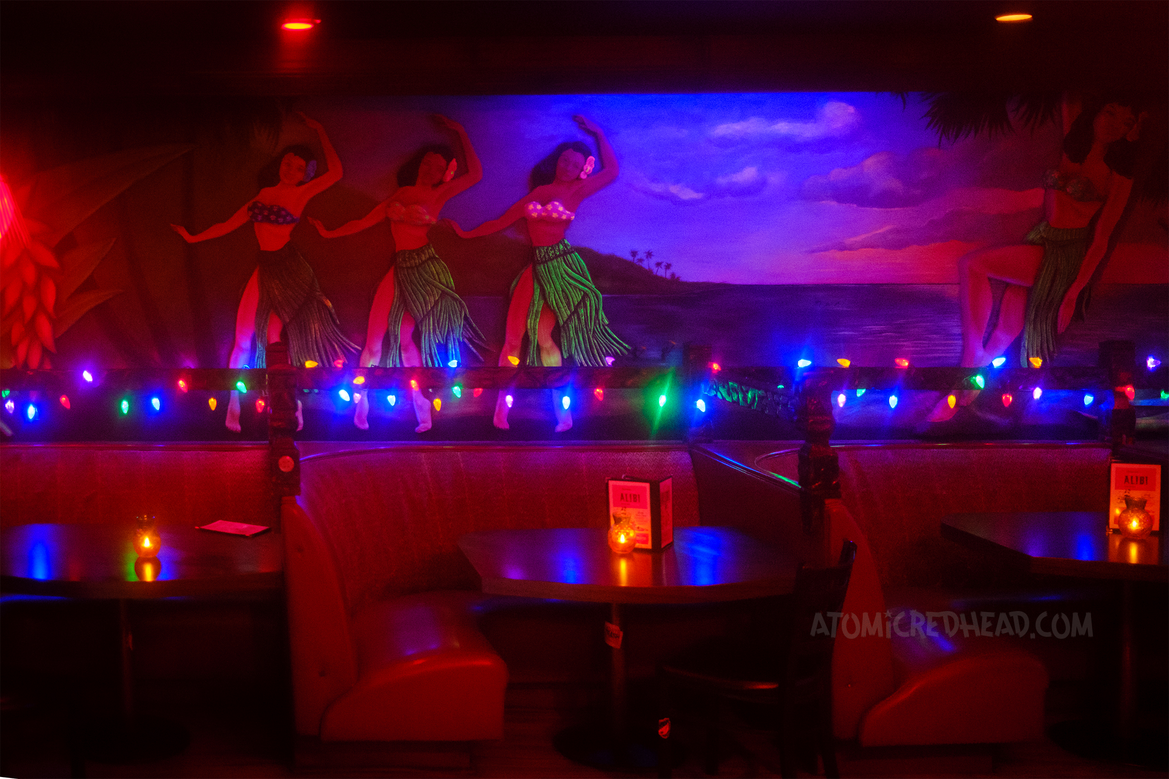 A large mural of hula girls.