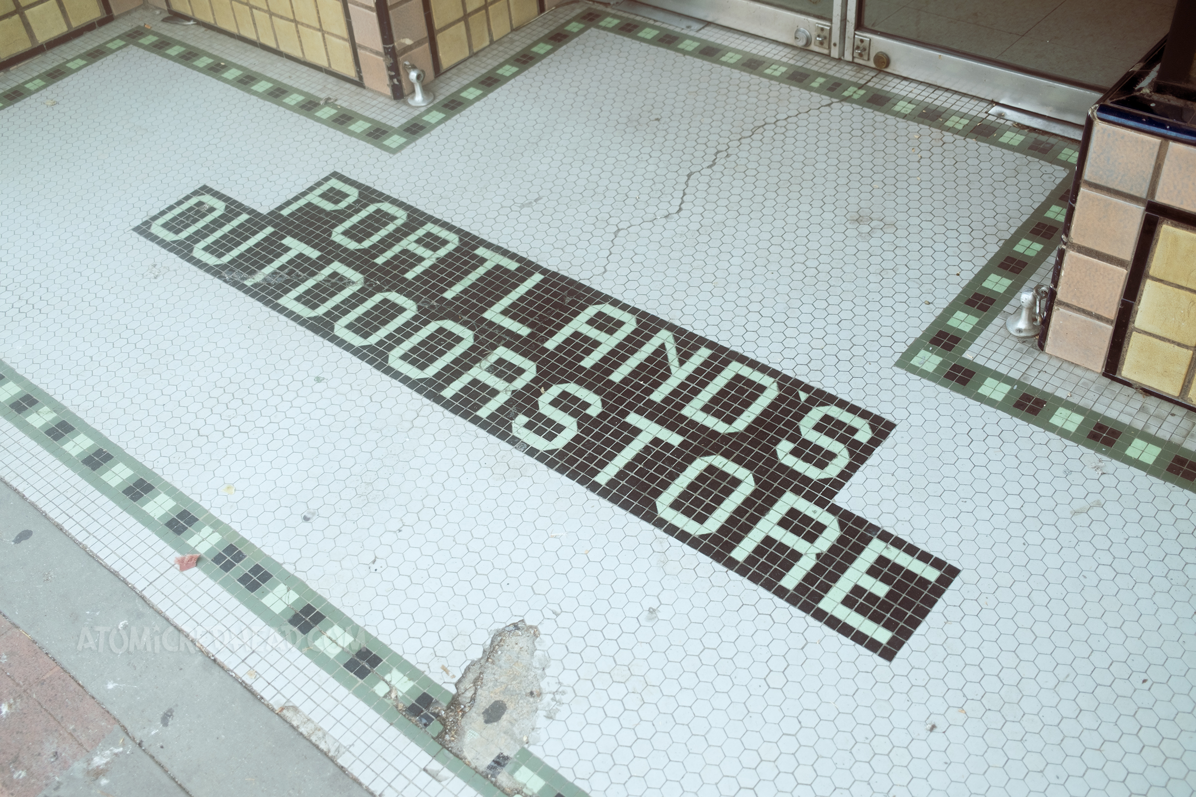 Mosaic tile entry reads "Portland's Outdoor Store"