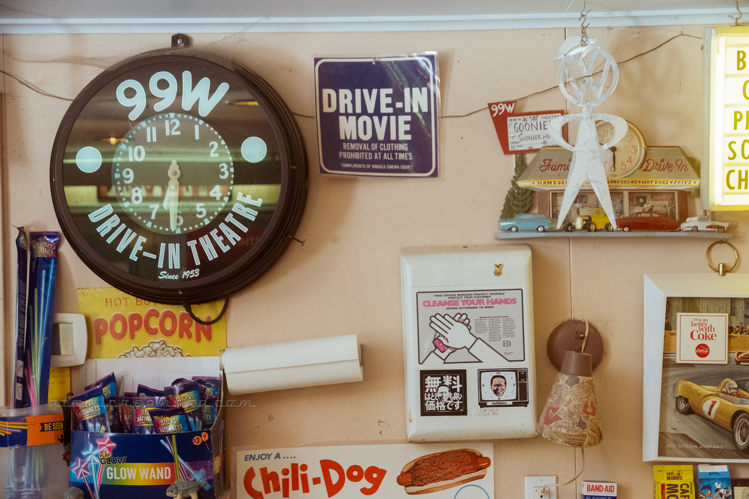 A clock reading "99W Drive-In Theatre" around the edge.
