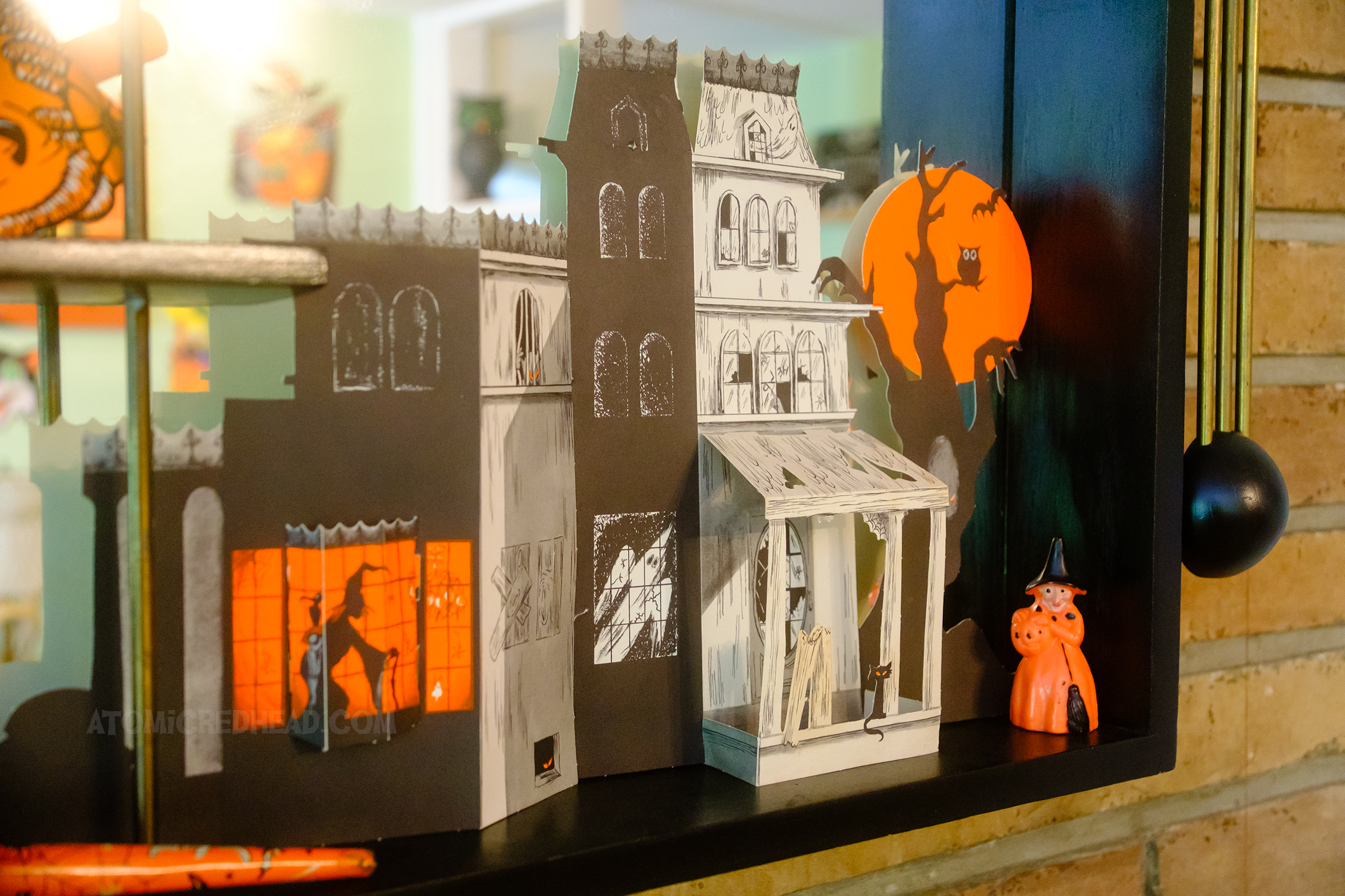 Close-up of a paper haunted house.